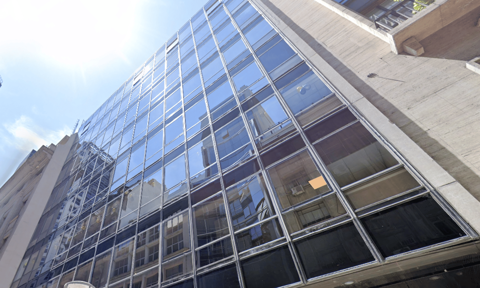 woman wearing yellow long-sleeved dress under white clouds and blue sky during daytime