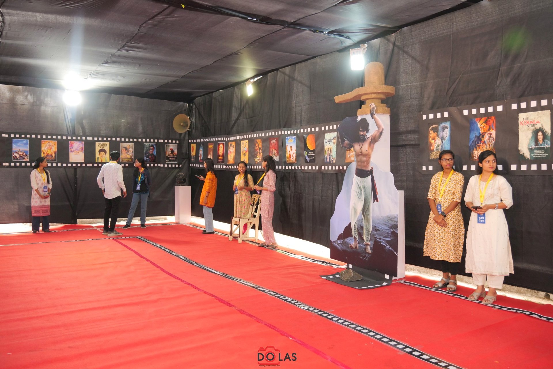 a white toilet sitting under a window next to a curtain