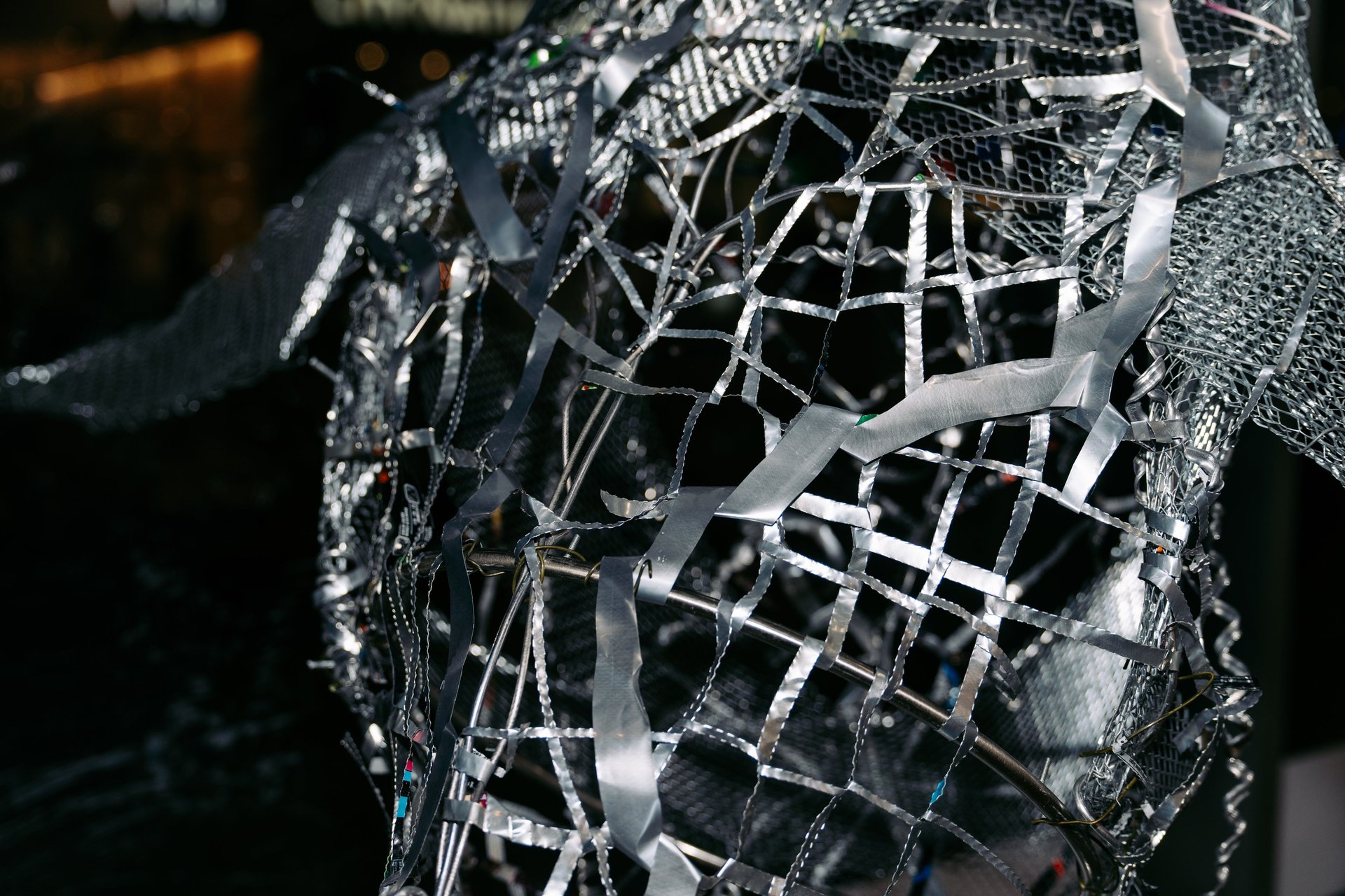 an abstract photo of a curved building with a blue sky in the background