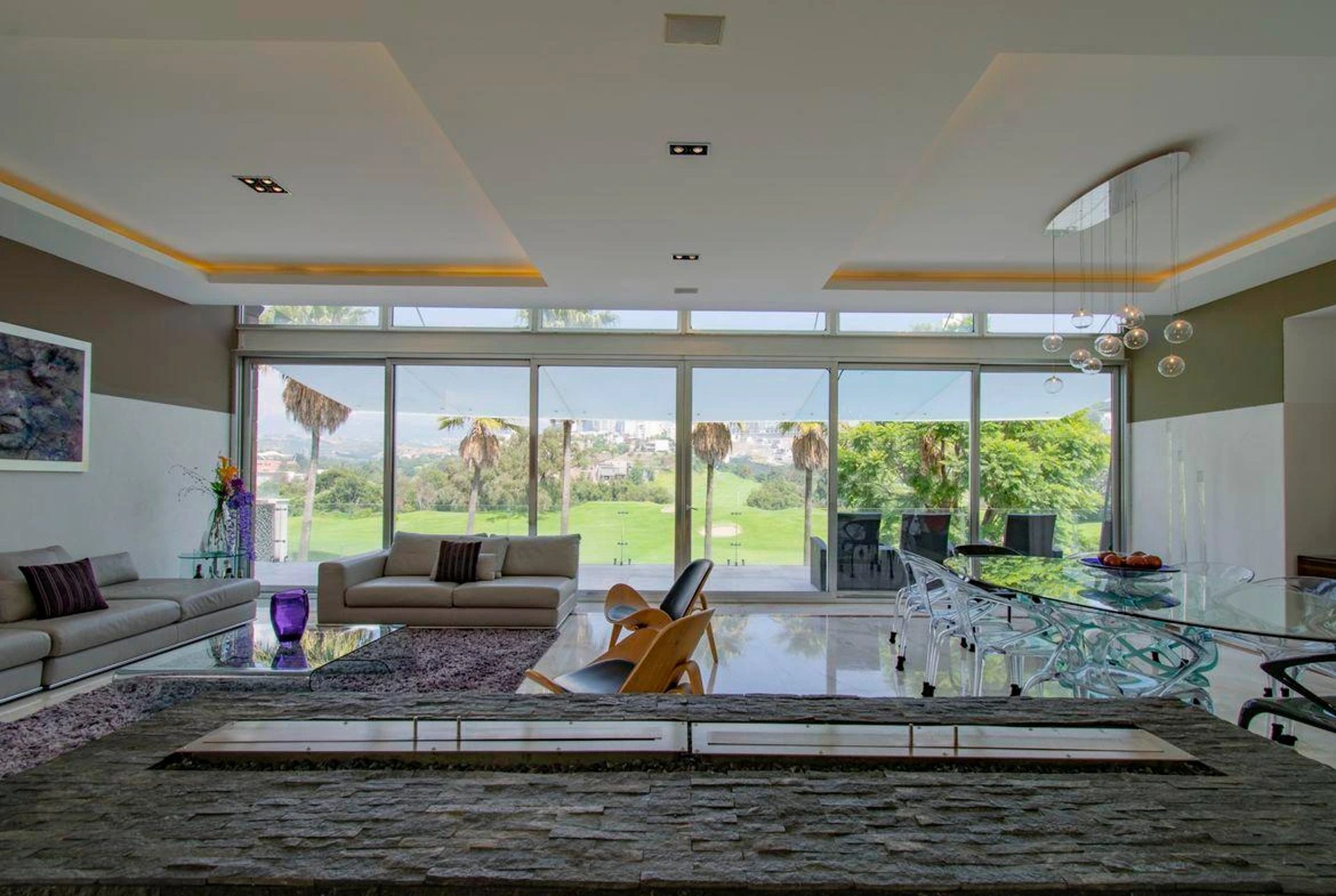 an abstract photo of a curved building with a blue sky in the background