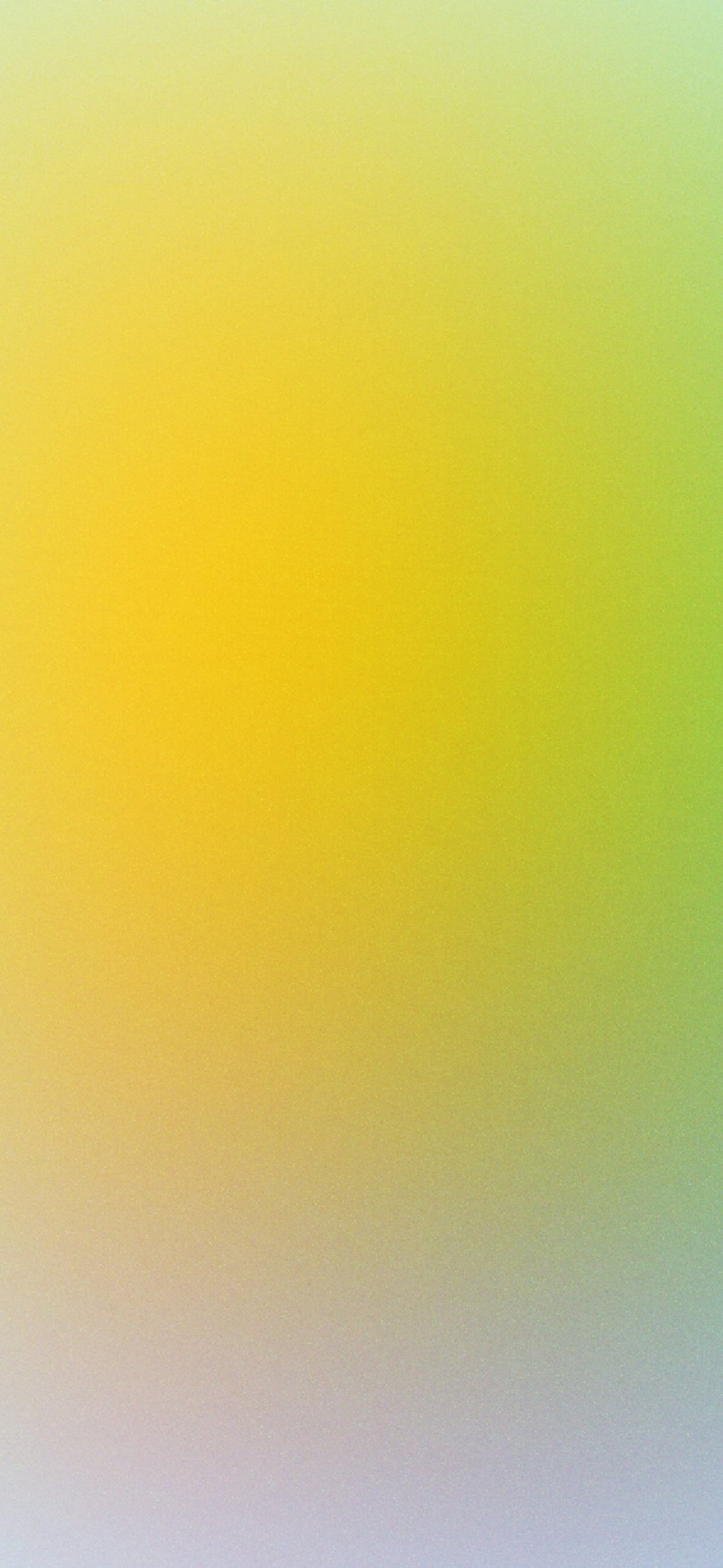 a blurry image of a red, yellow and blue background