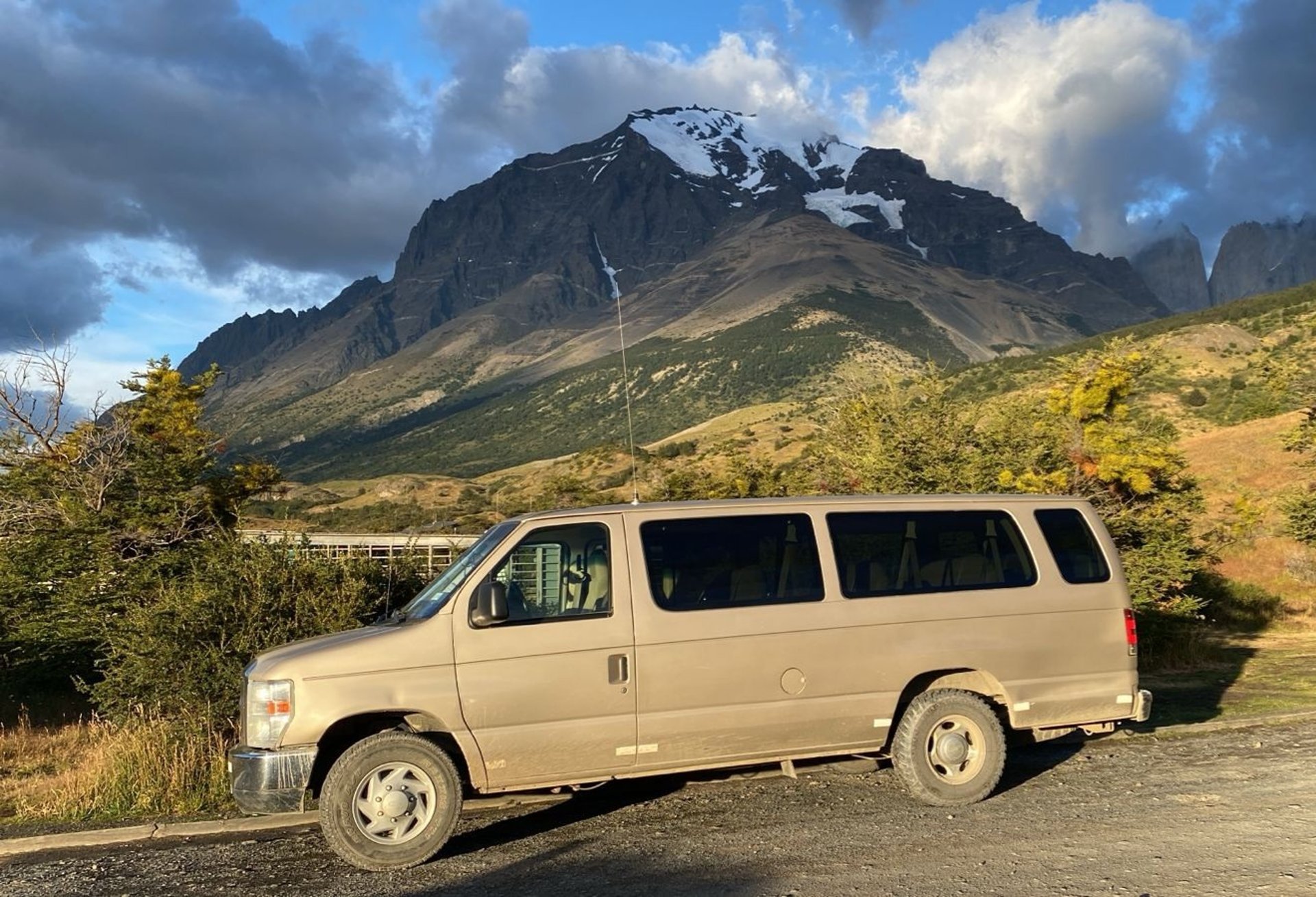 woman wearing yellow long-sleeved dress under white clouds and blue sky during daytime