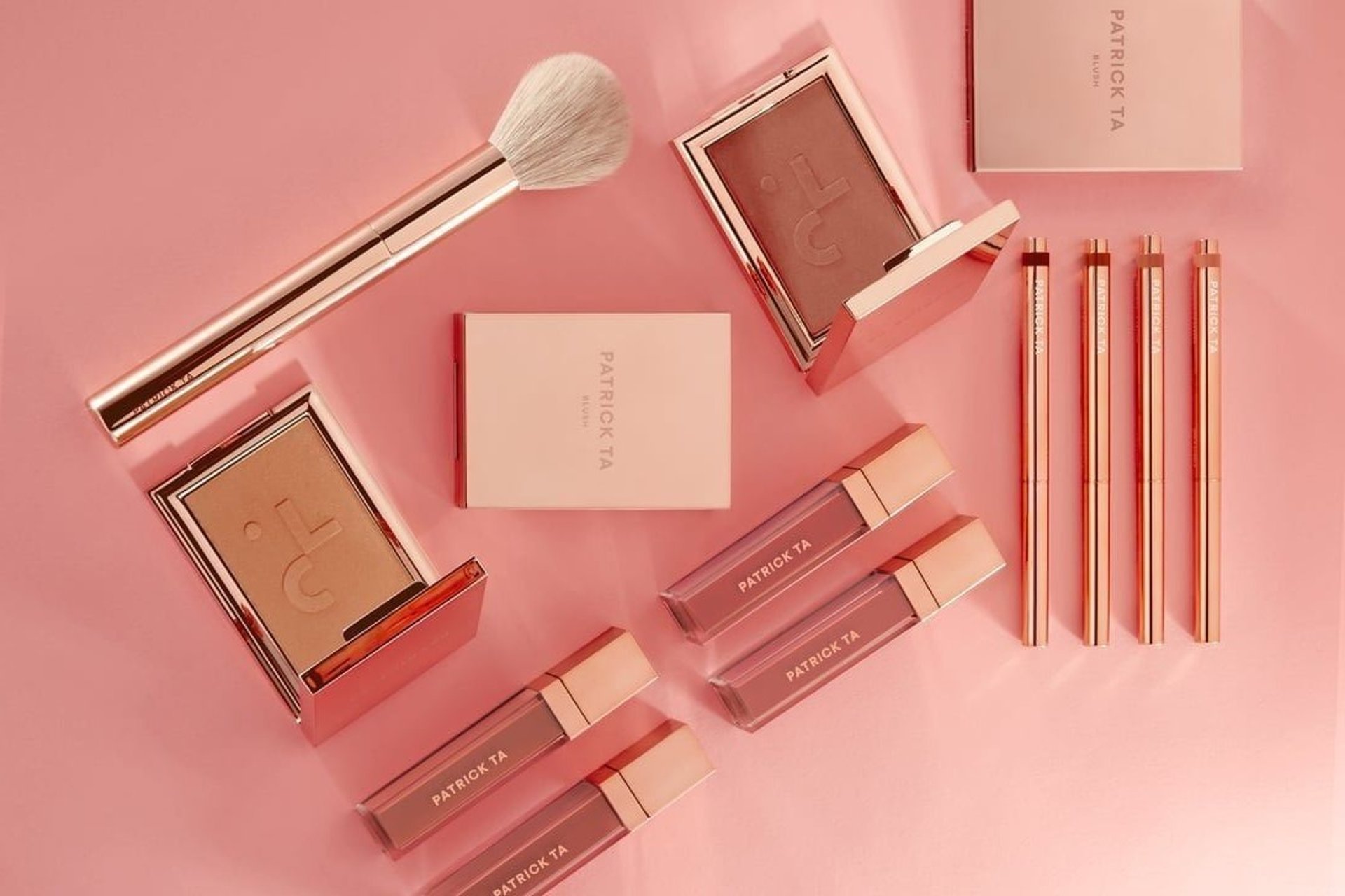 photo of assorted makeup products on gray surface