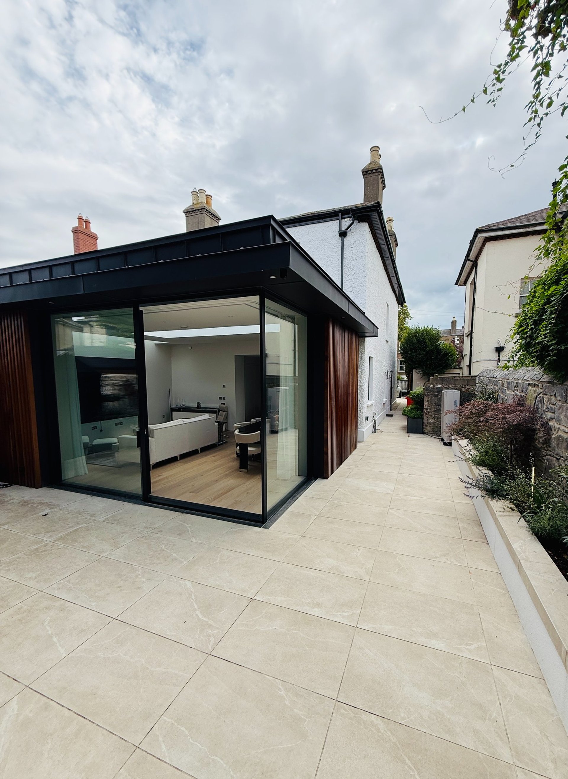 an abstract photo of a curved building with a blue sky in the background