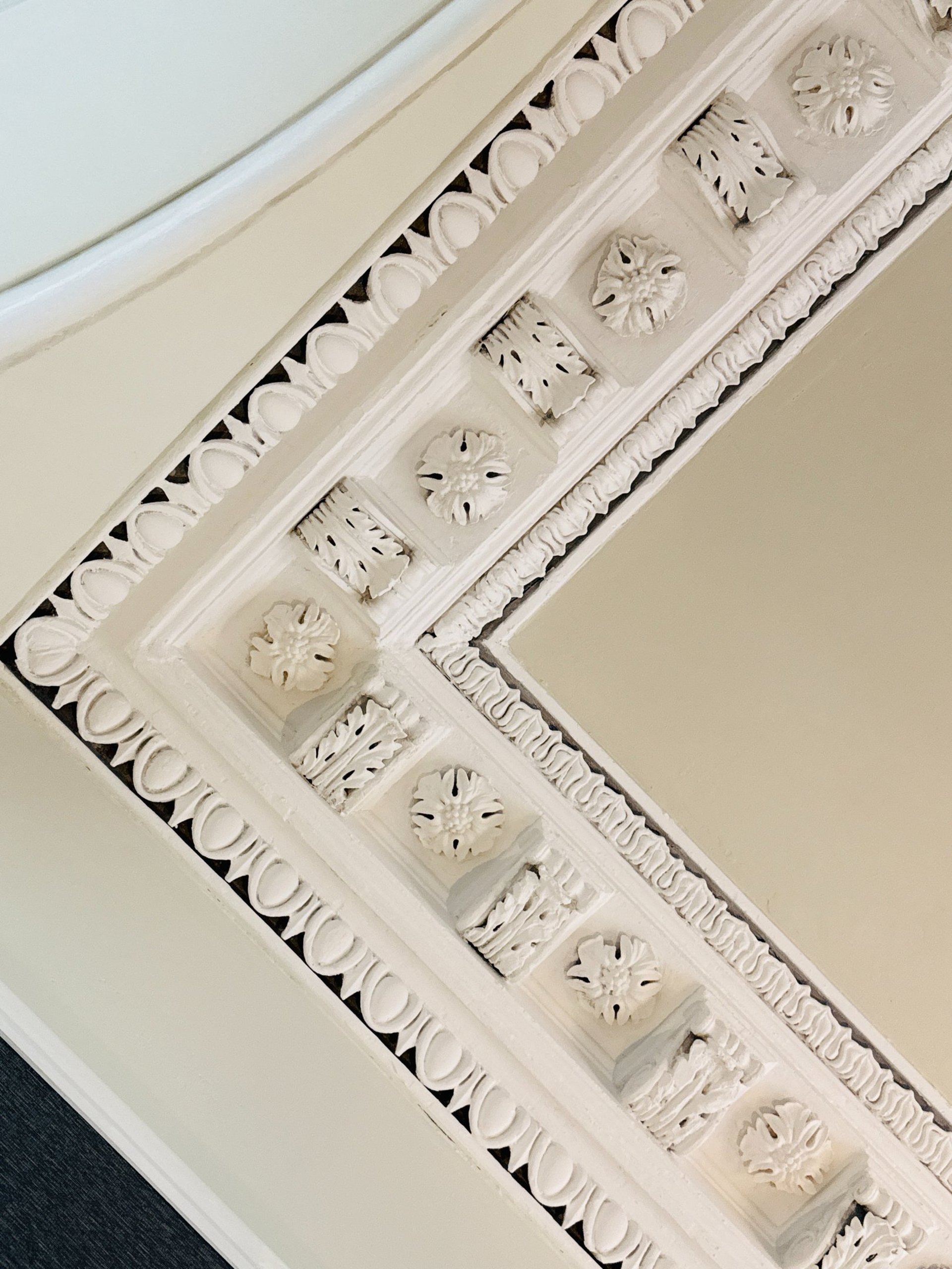 an abstract photo of a curved building with a blue sky in the background