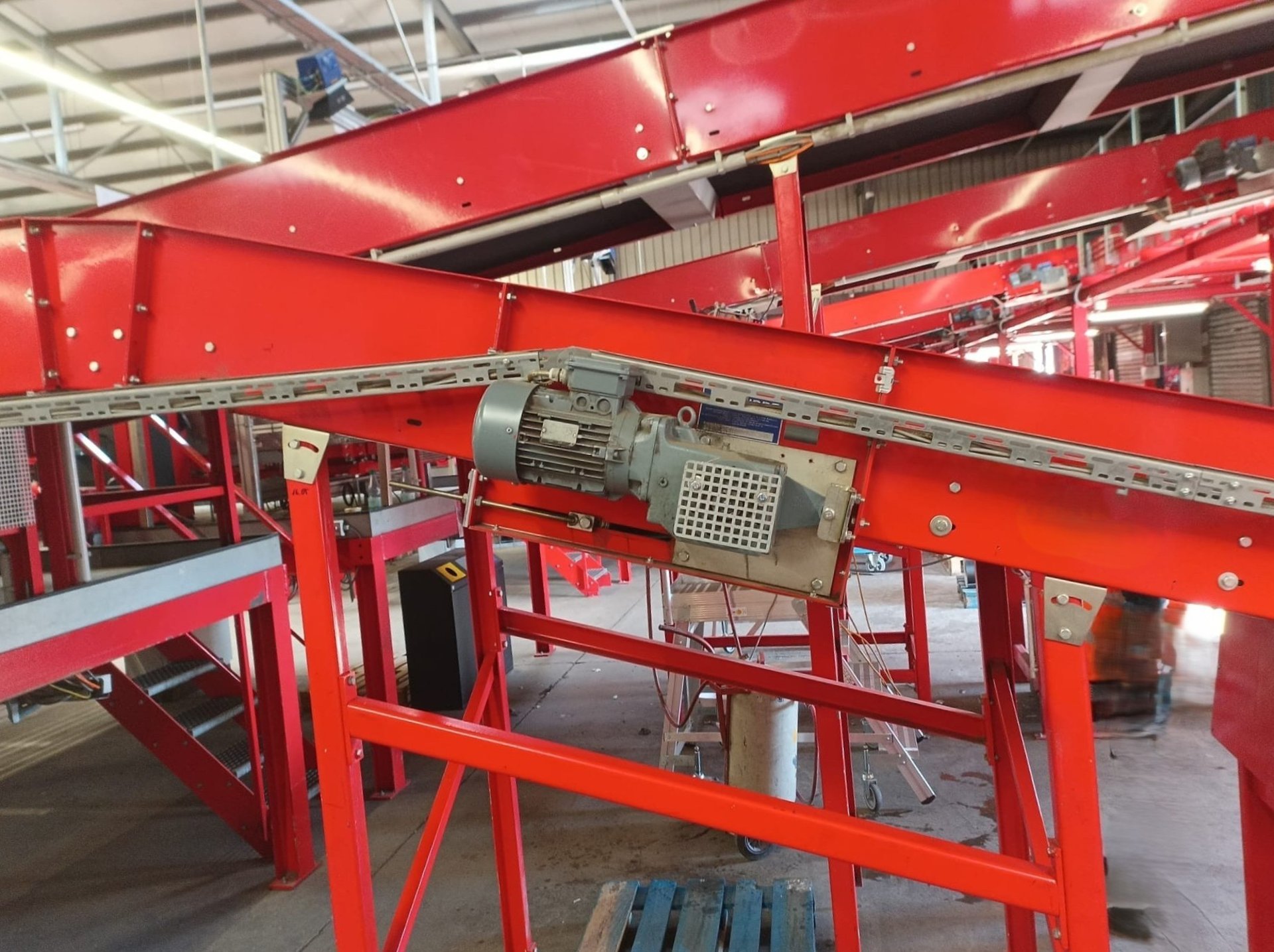 a conveyor belt filled with lots of money