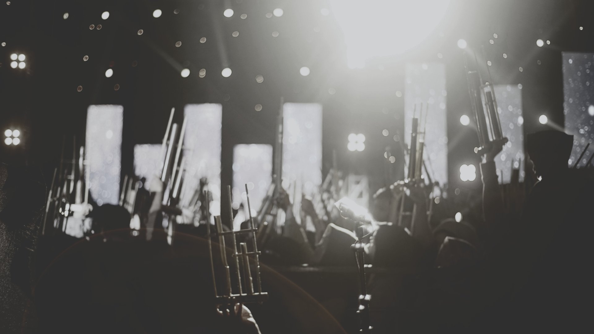 an abstract photo of a curved building with a blue sky in the background