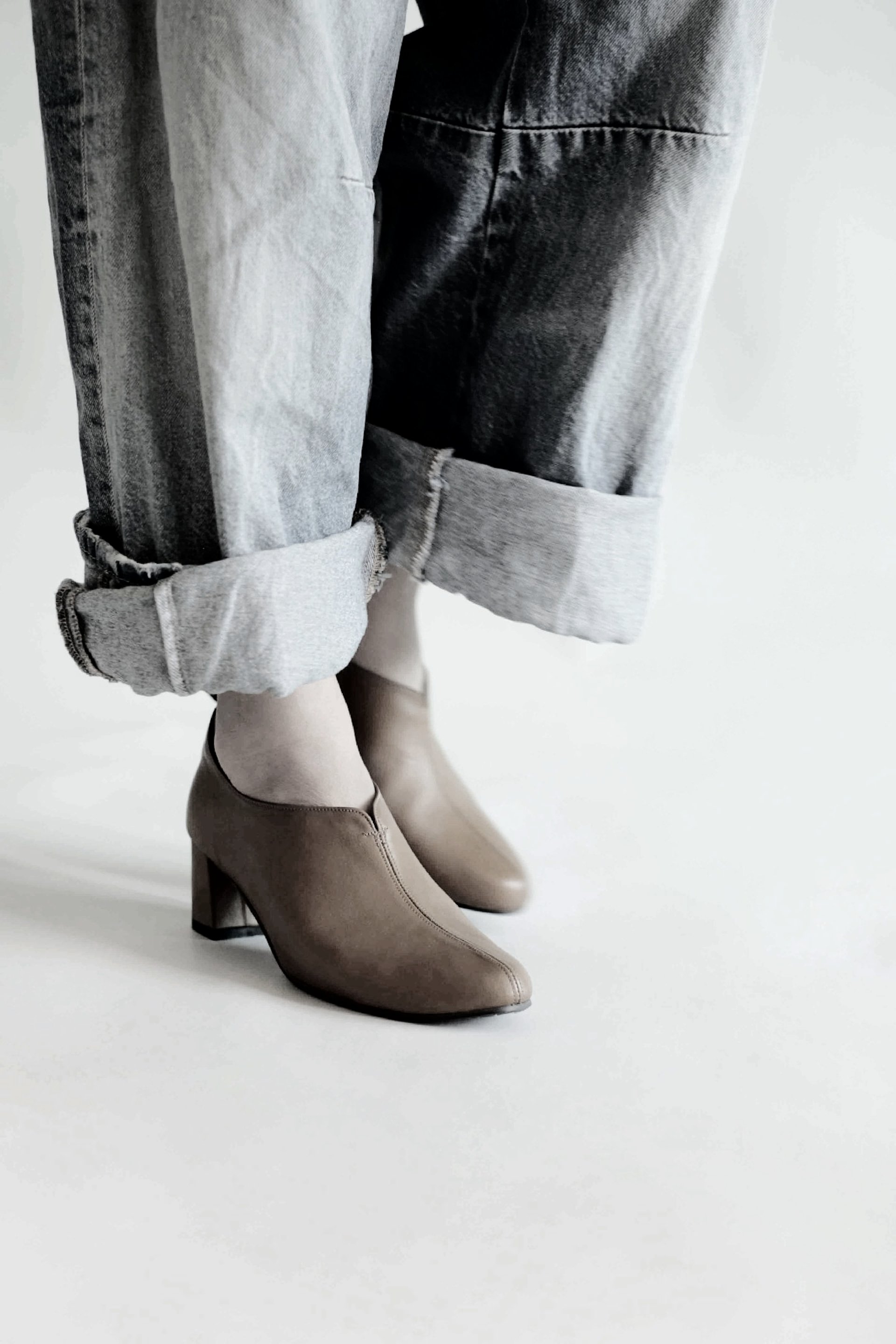 woman wearing yellow long-sleeved dress under white clouds and blue sky during daytime