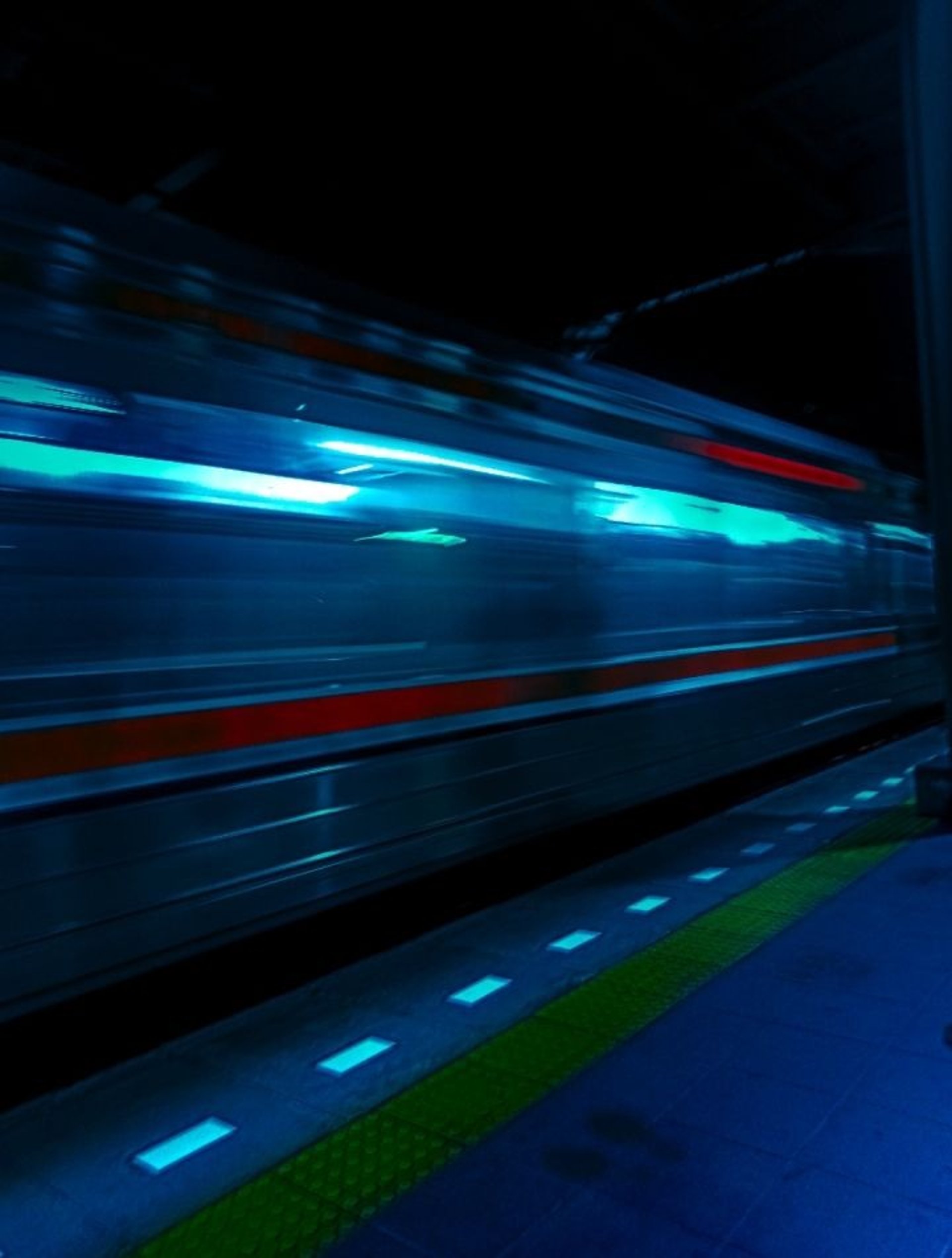 Hands typing on keyboard near computer monitor
