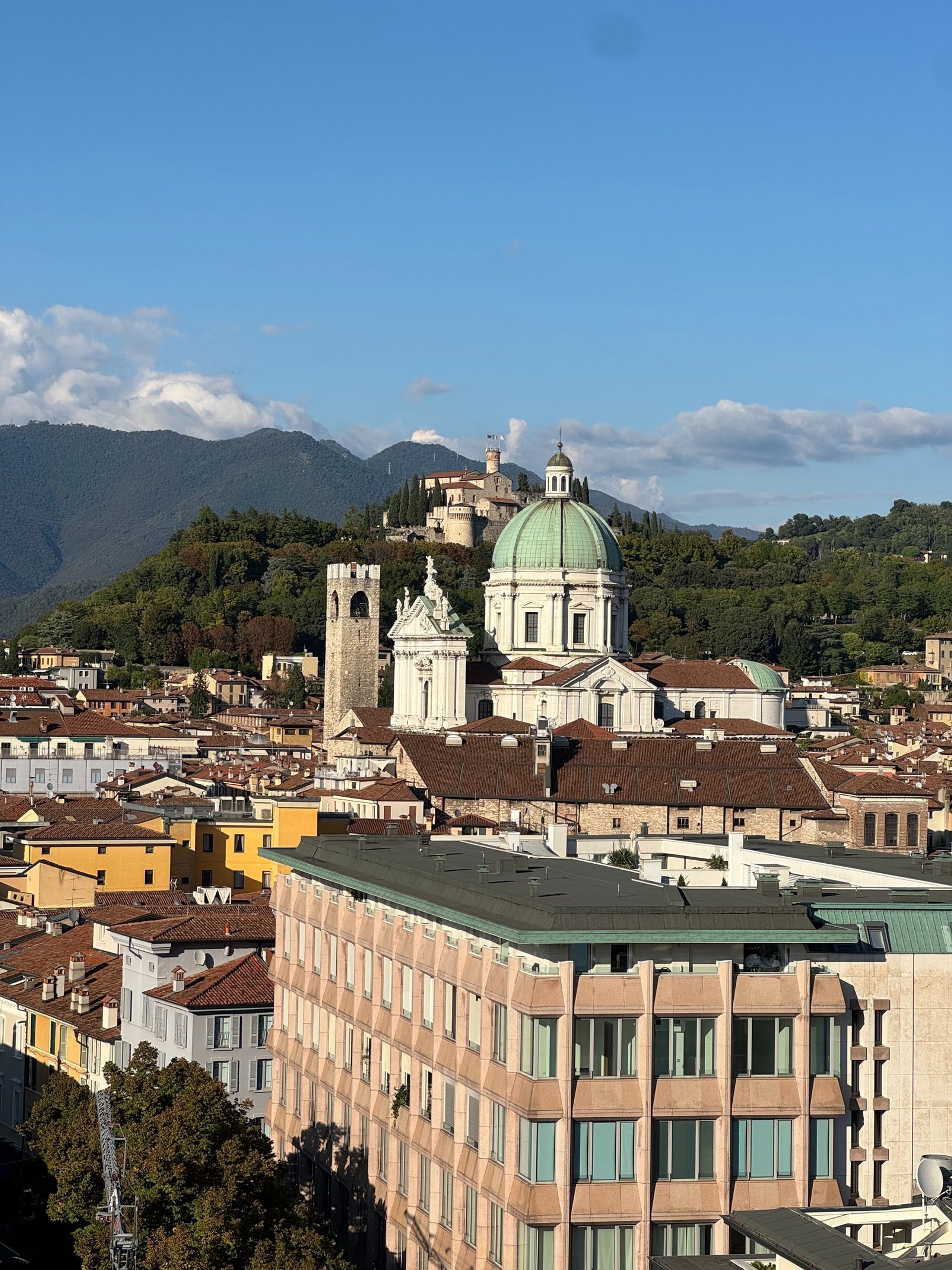 an abstract photo of a curved building with a blue sky in the background