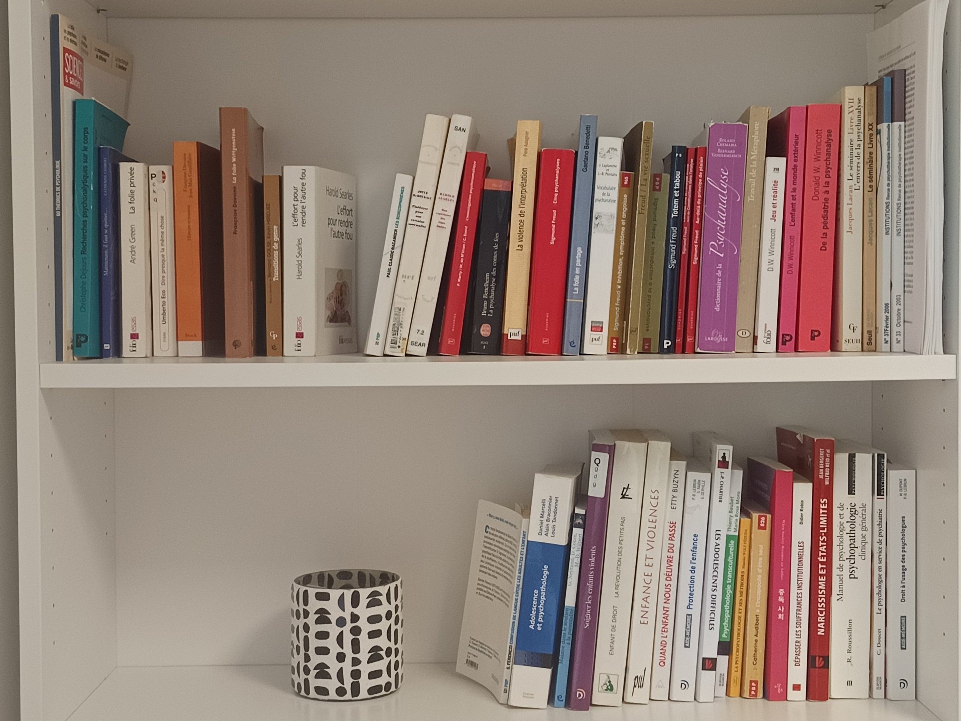an abstract photo of a curved building with a blue sky in the background