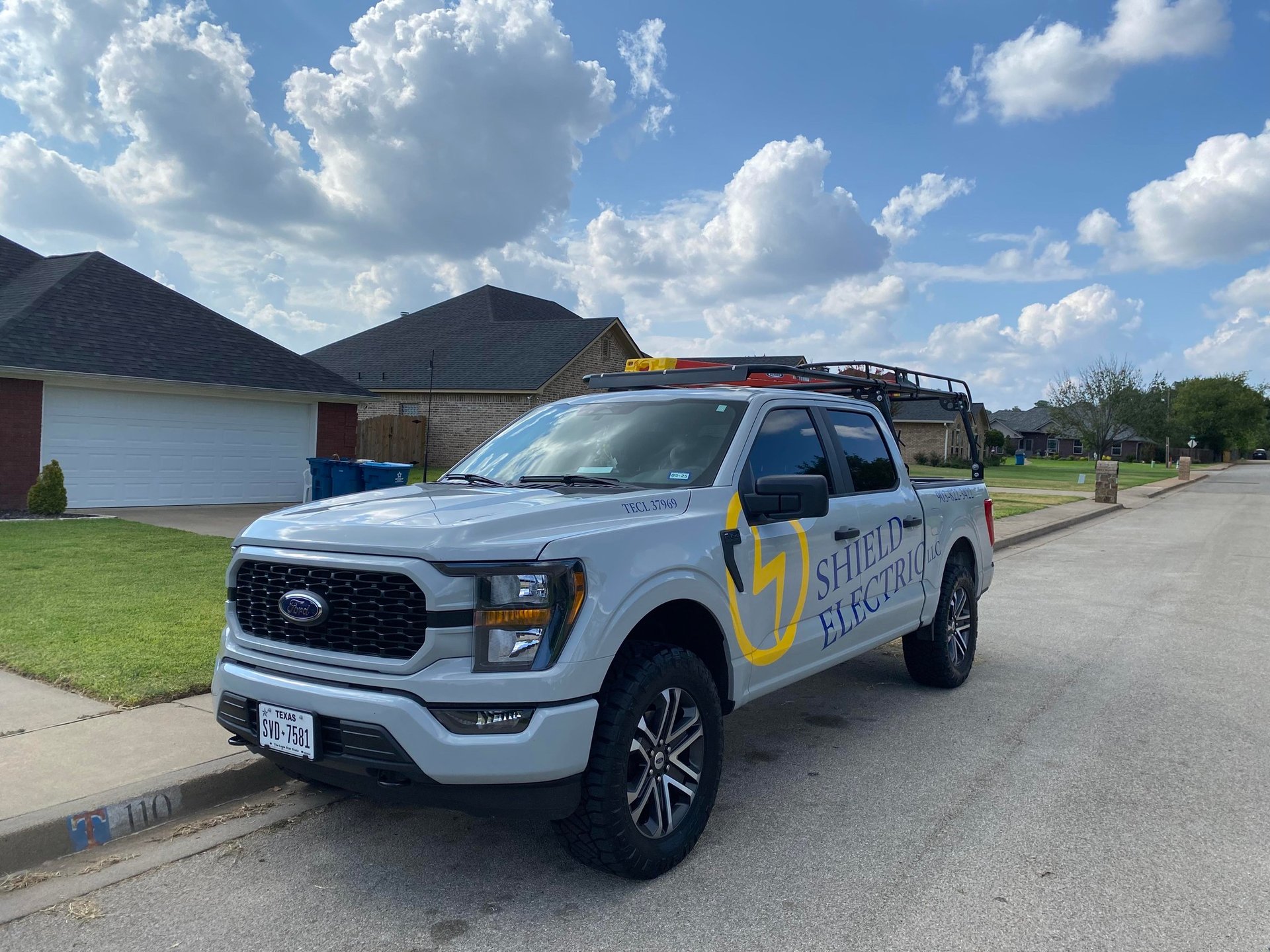 woman wearing yellow long-sleeved dress under white clouds and blue sky during daytime
