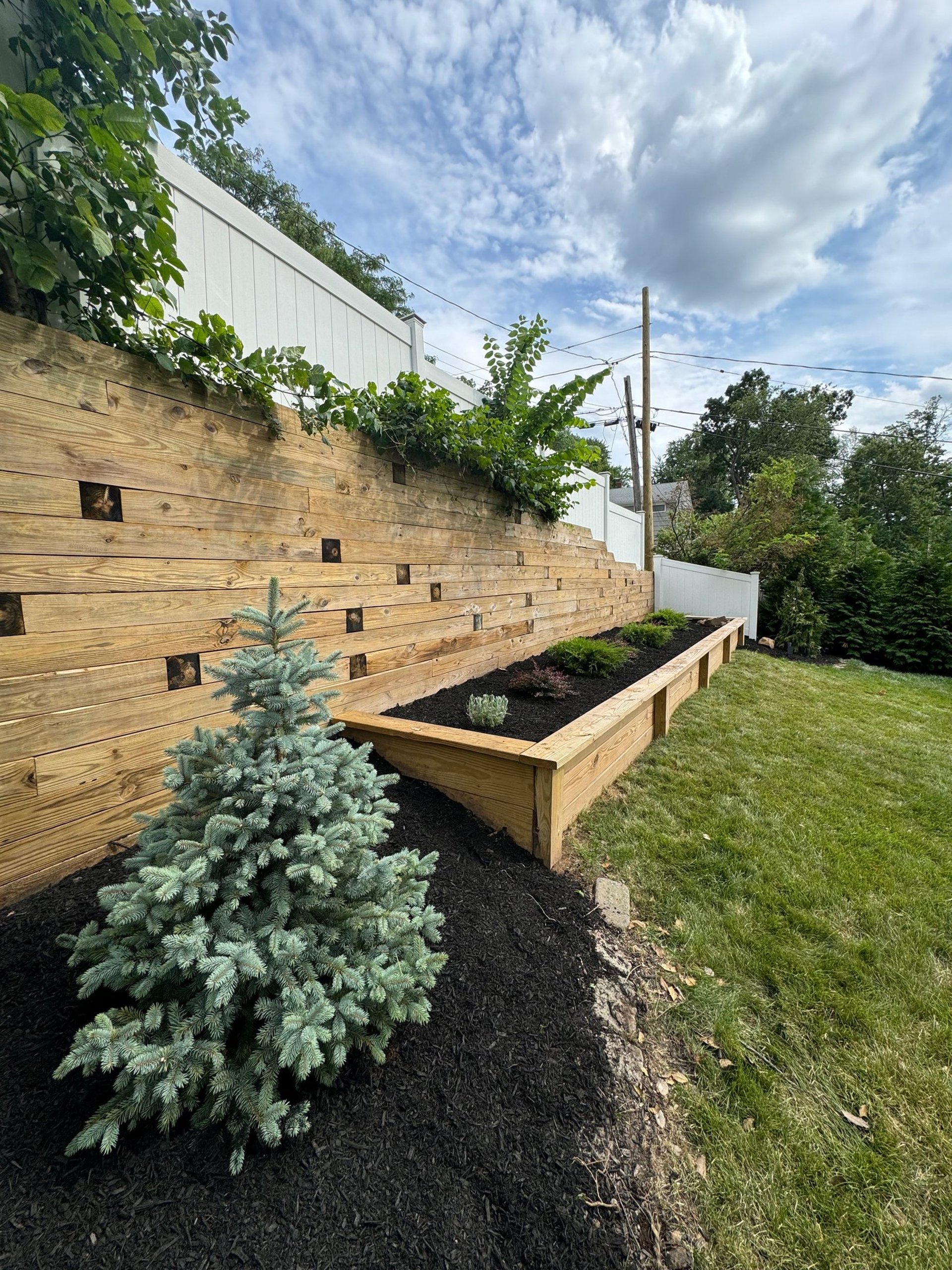 an abstract photo of a curved building with a blue sky in the background