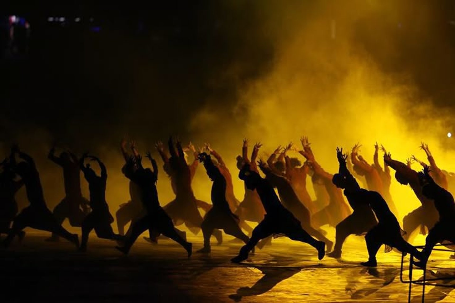 an abstract photo of a curved building with a blue sky in the background