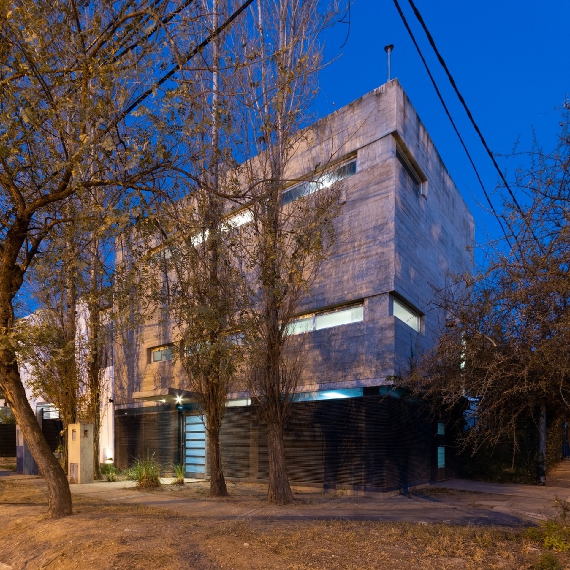 an abstract photo of a curved building with a blue sky in the background