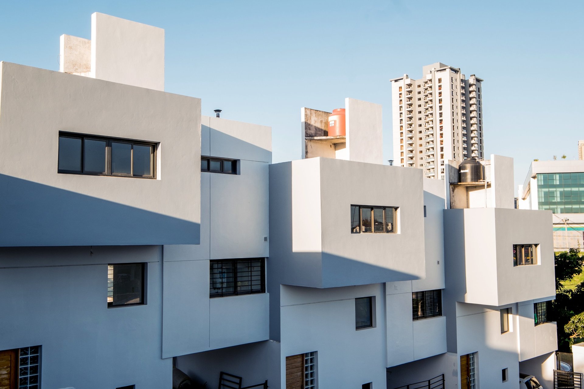 an abstract photo of a curved building with a blue sky in the background