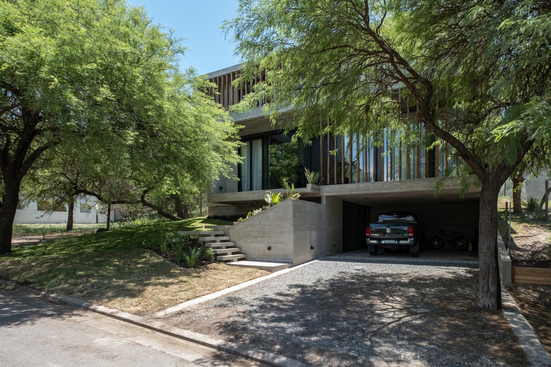 an abstract photo of a curved building with a blue sky in the background