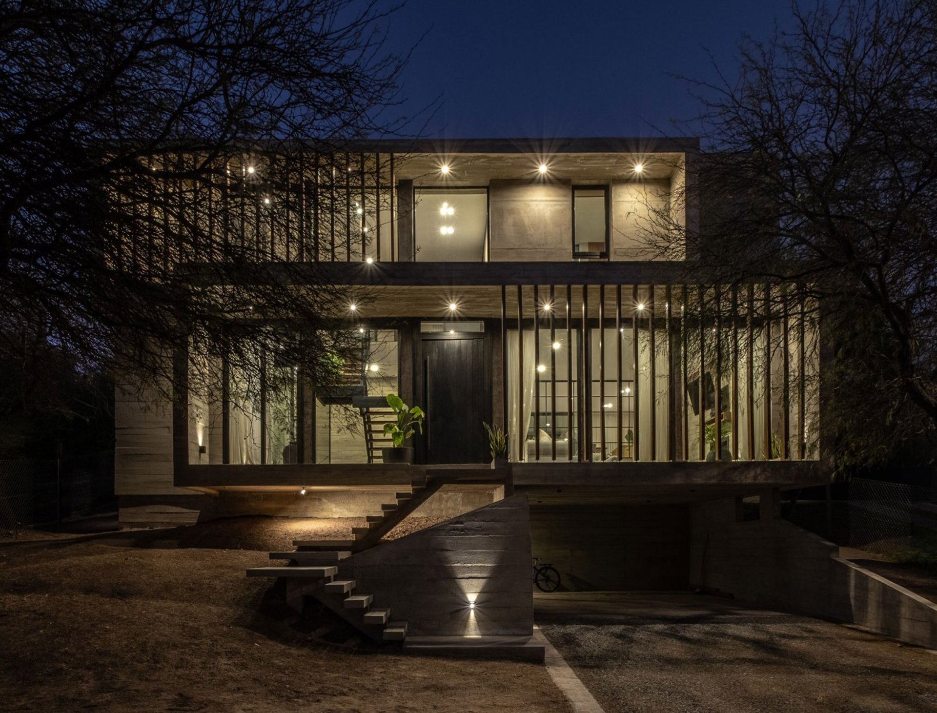 an abstract photo of a curved building with a blue sky in the background