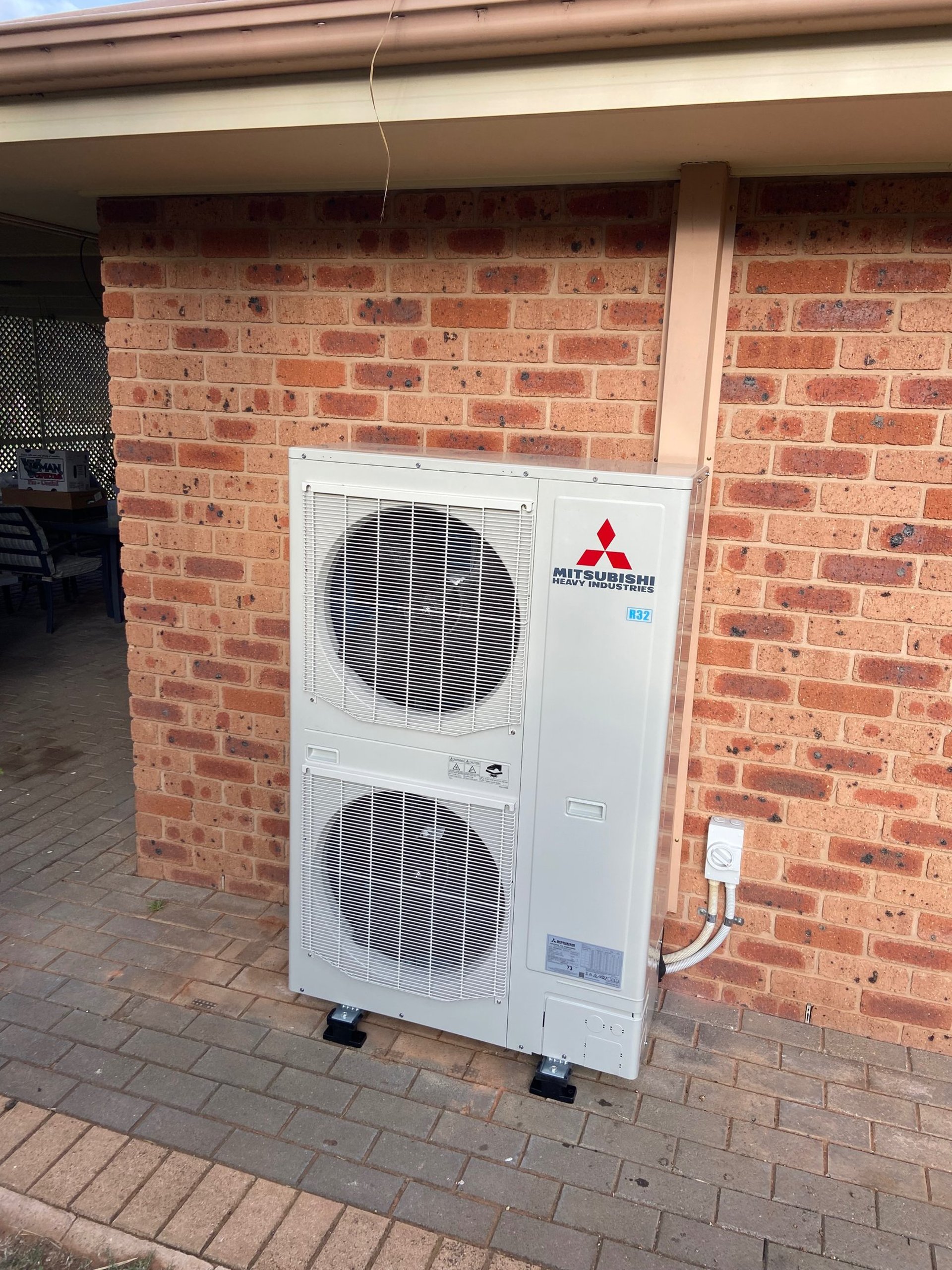 woman wearing yellow long-sleeved dress under white clouds and blue sky during daytime
