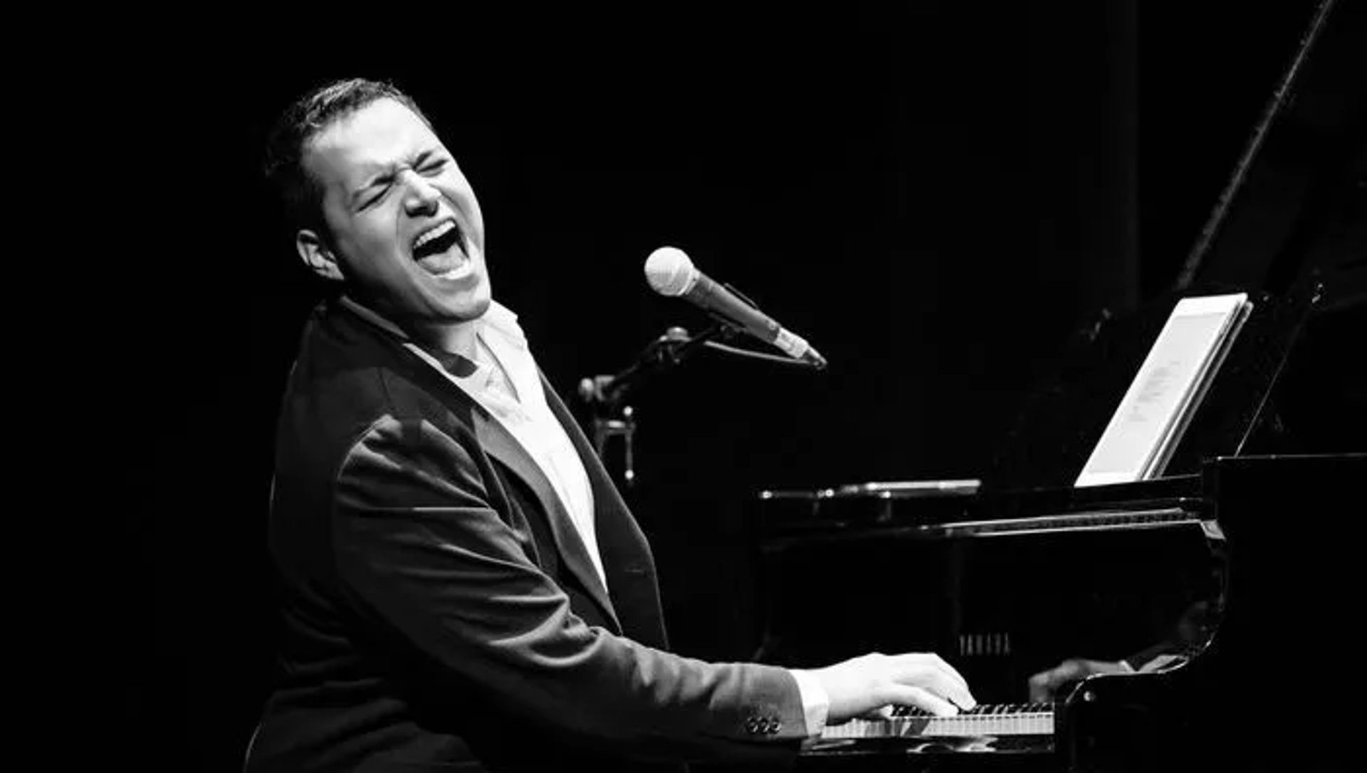 an abstract photo of a curved building with a blue sky in the background