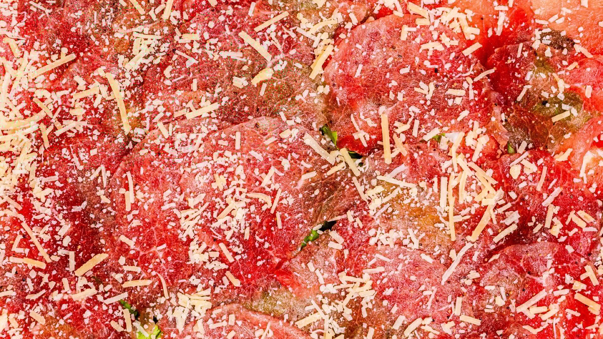 an abstract photo of a curved building with a blue sky in the background
