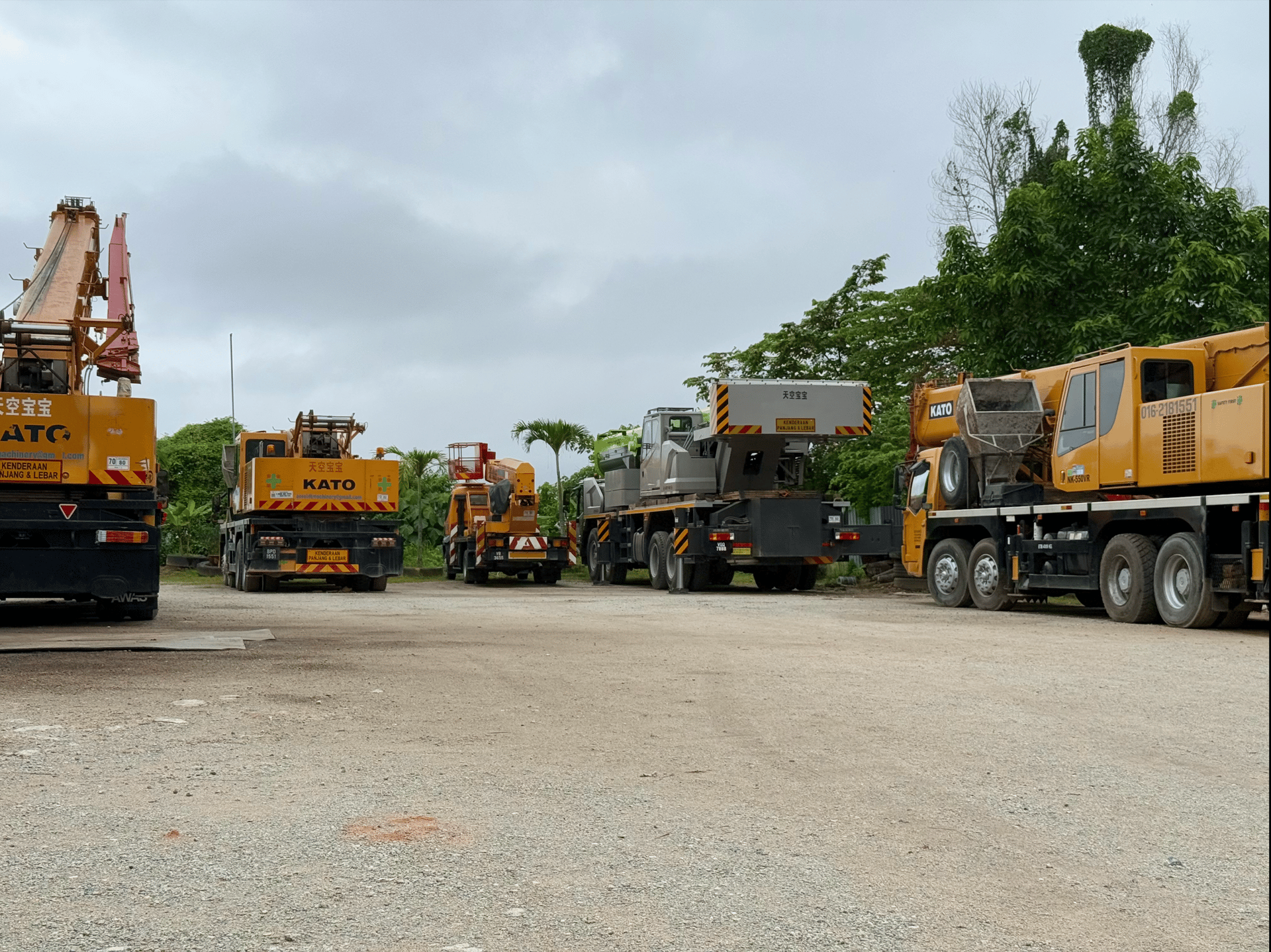 yellow and black excavator on rocky ground