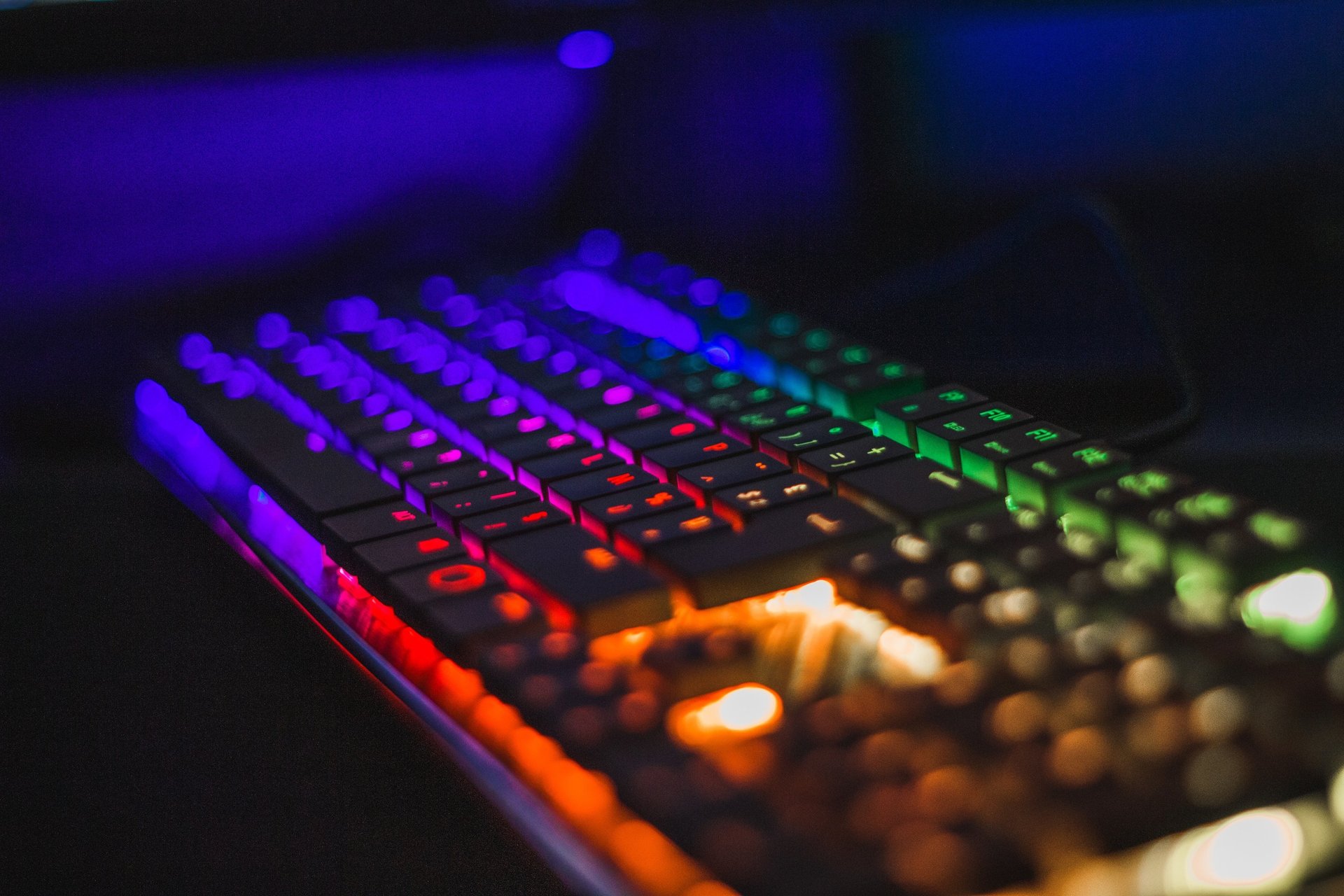 black computer keyboard on brown wooden table
