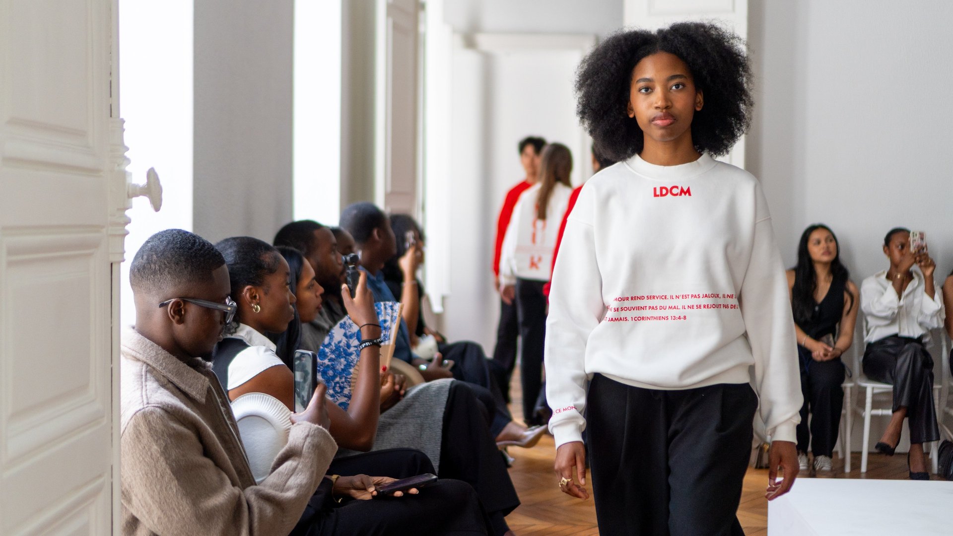 an abstract photo of a curved building with a blue sky in the background