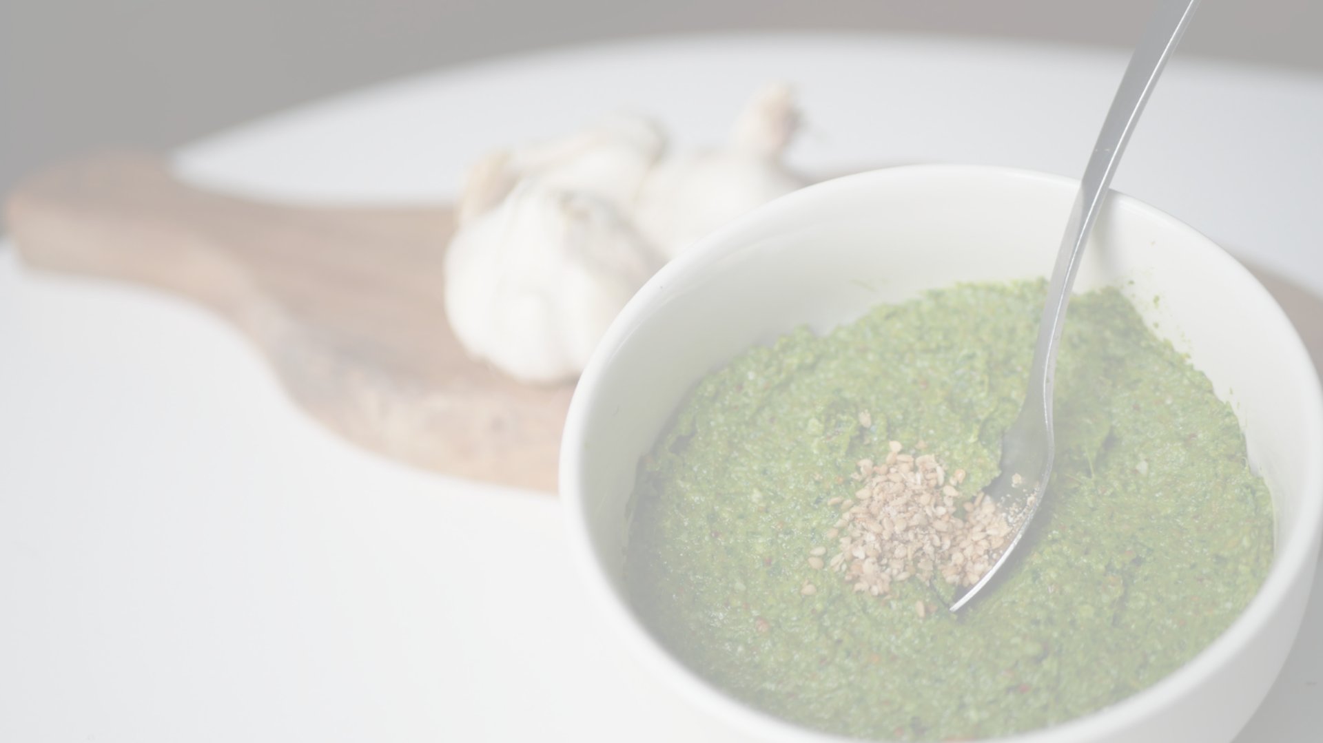 an abstract photo of a curved building with a blue sky in the background