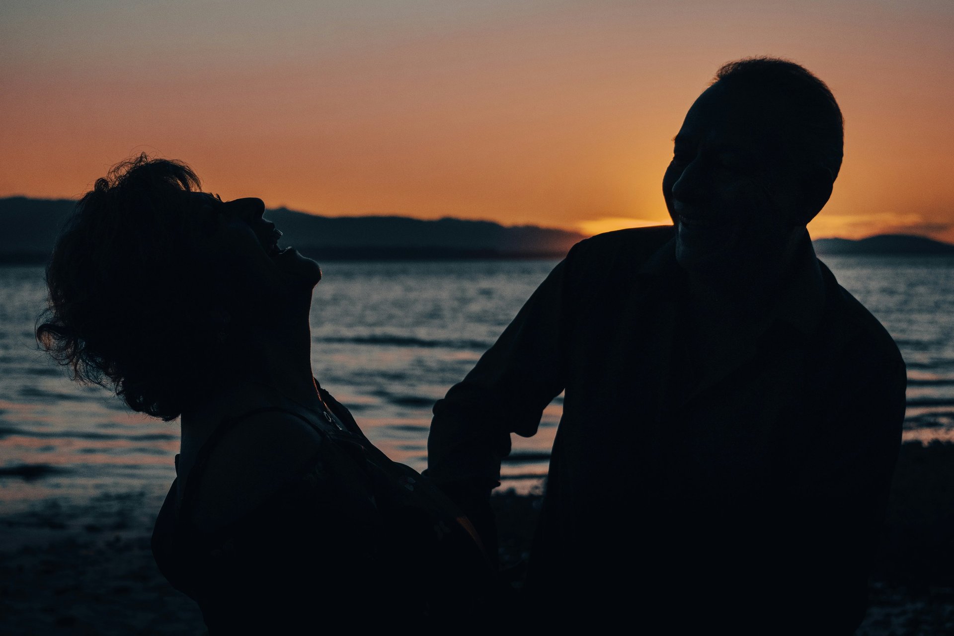 silhouette of hugging couple