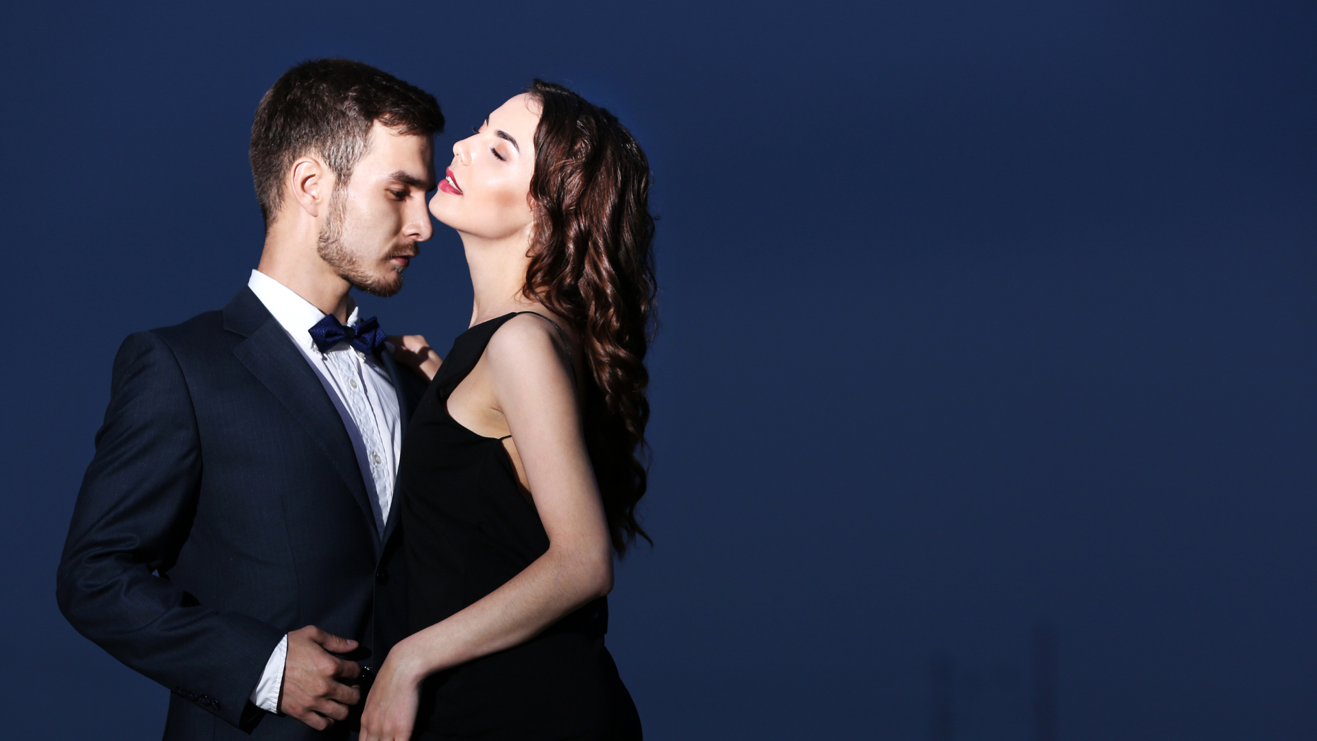 an abstract photo of a curved building with a blue sky in the background