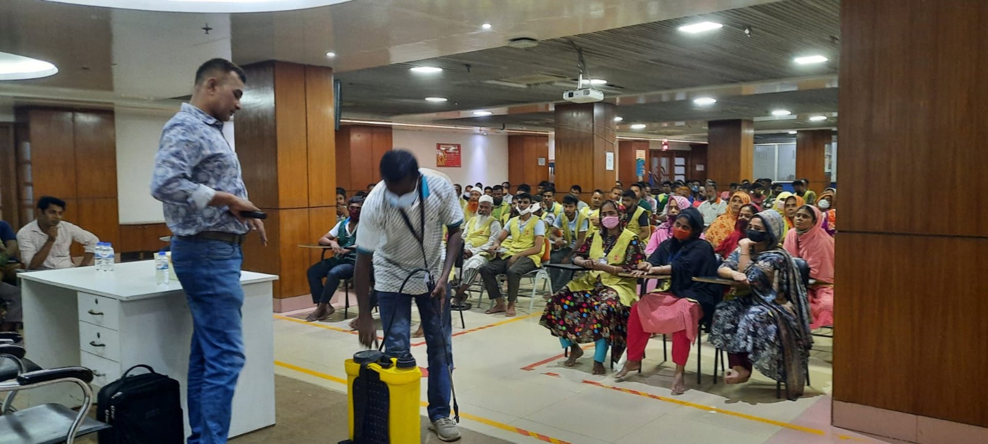 a chair and a table with a vase of flowers on it