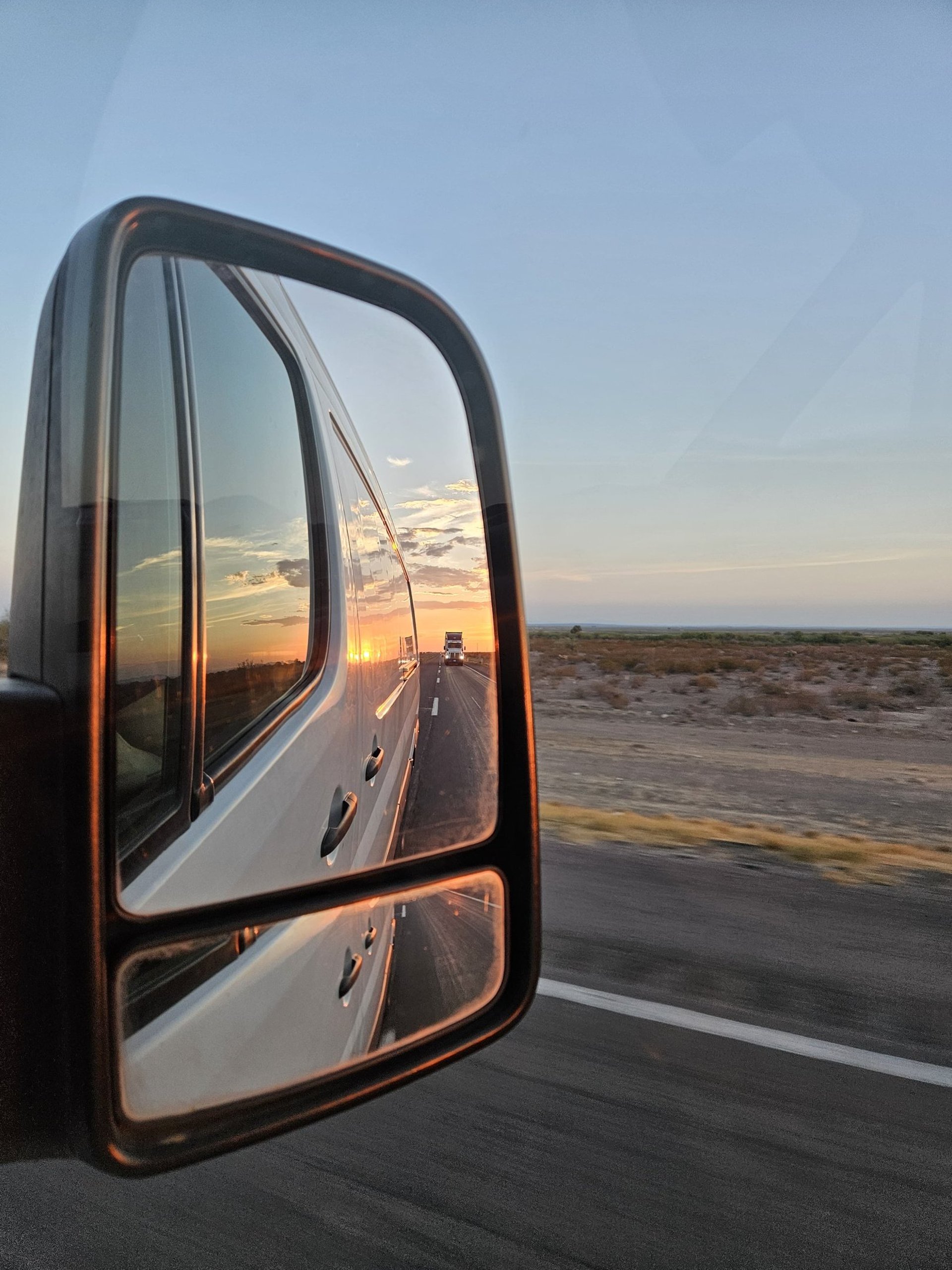 black truck on road during daytime