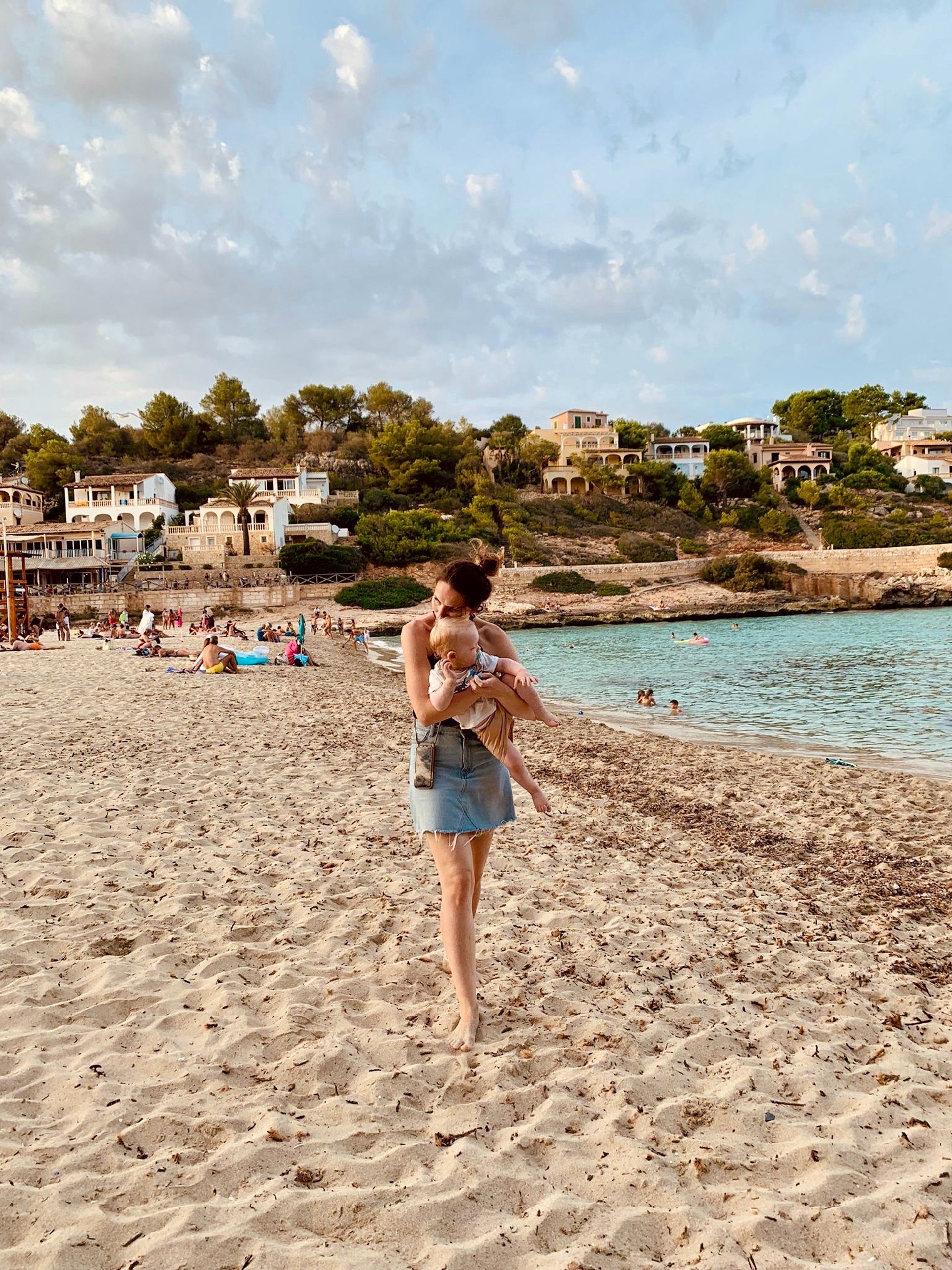 woman wearing yellow long-sleeved dress under white clouds and blue sky during daytime