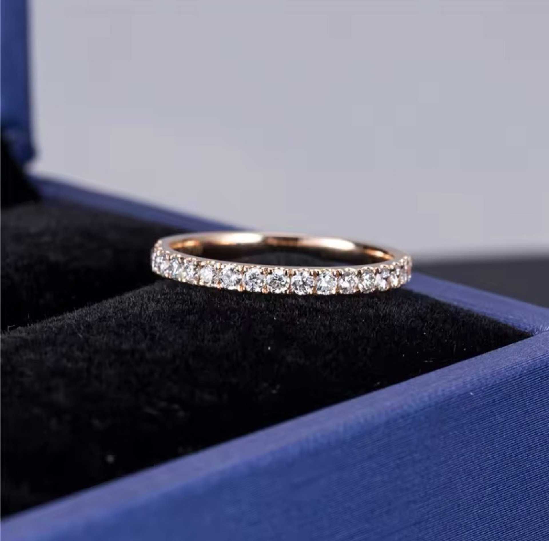 two wedding rings sitting on top of a white cloth