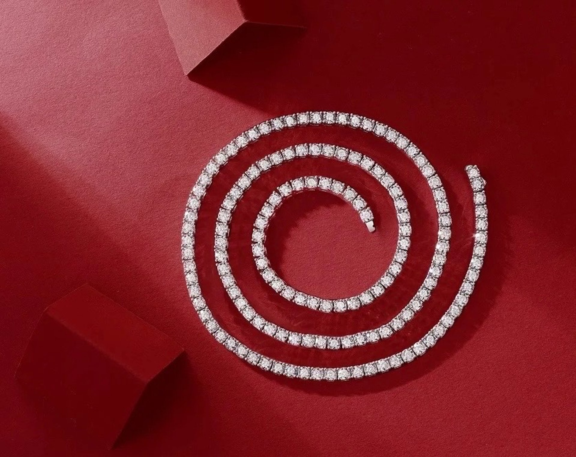 two wedding rings sitting on top of a white cloth