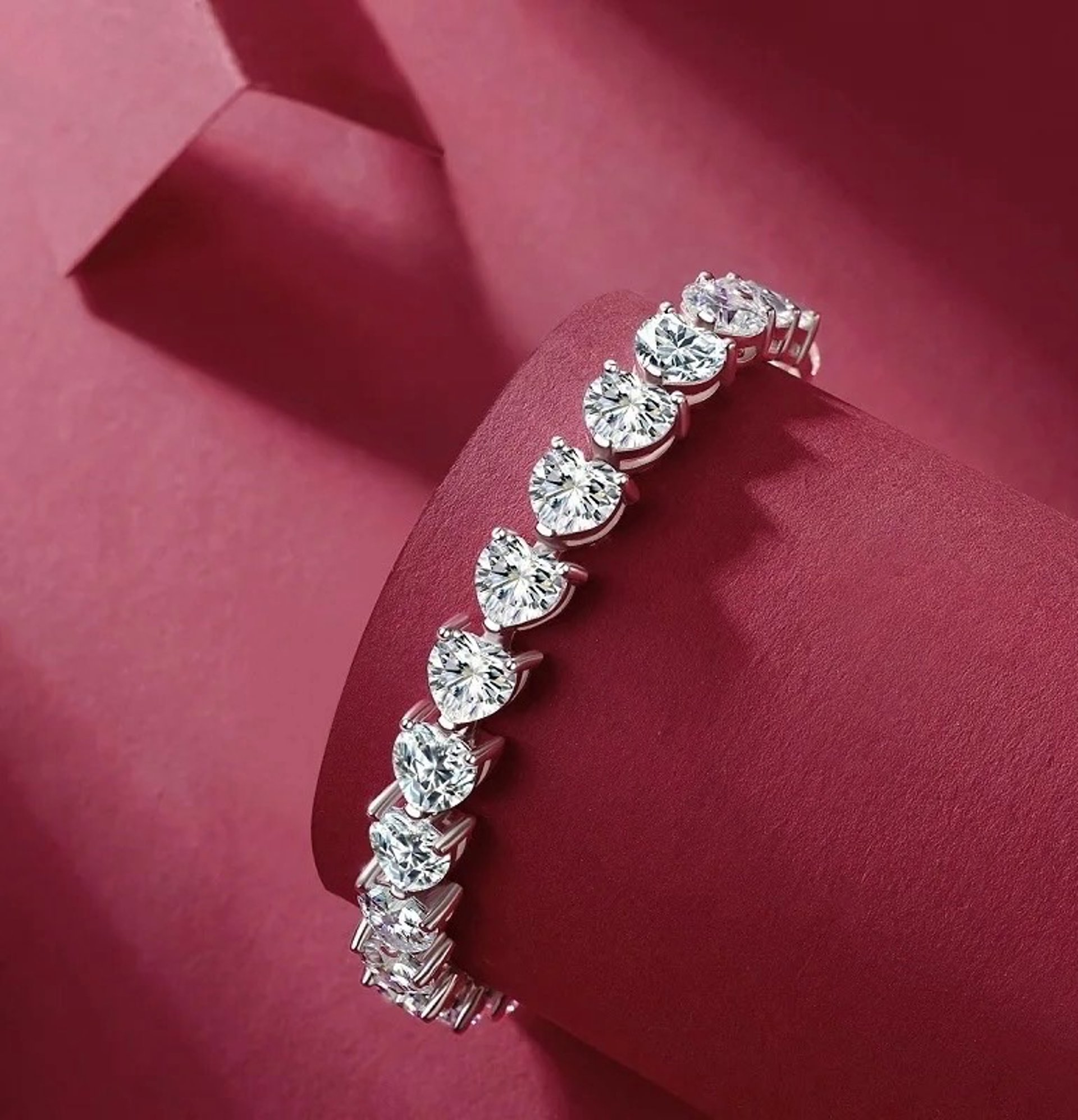 two wedding rings sitting on top of a white cloth