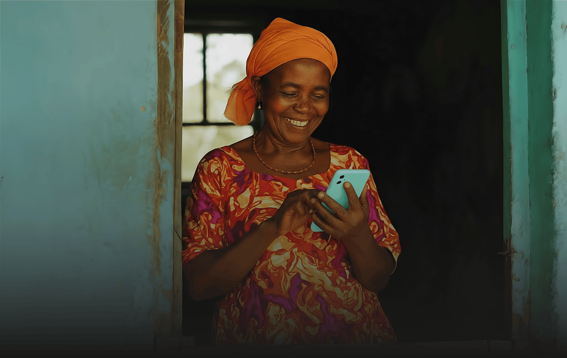 Bankeaz - An African mother receives money from her son on the Bankeaz app.