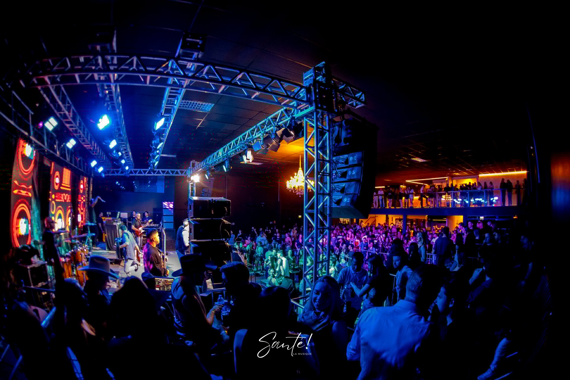 an abstract photo of a curved building with a blue sky in the background