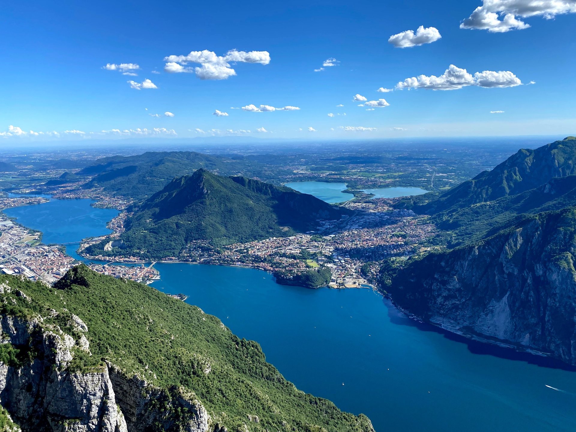 Panoramic view of Lake Como with mountains and villages at sunset