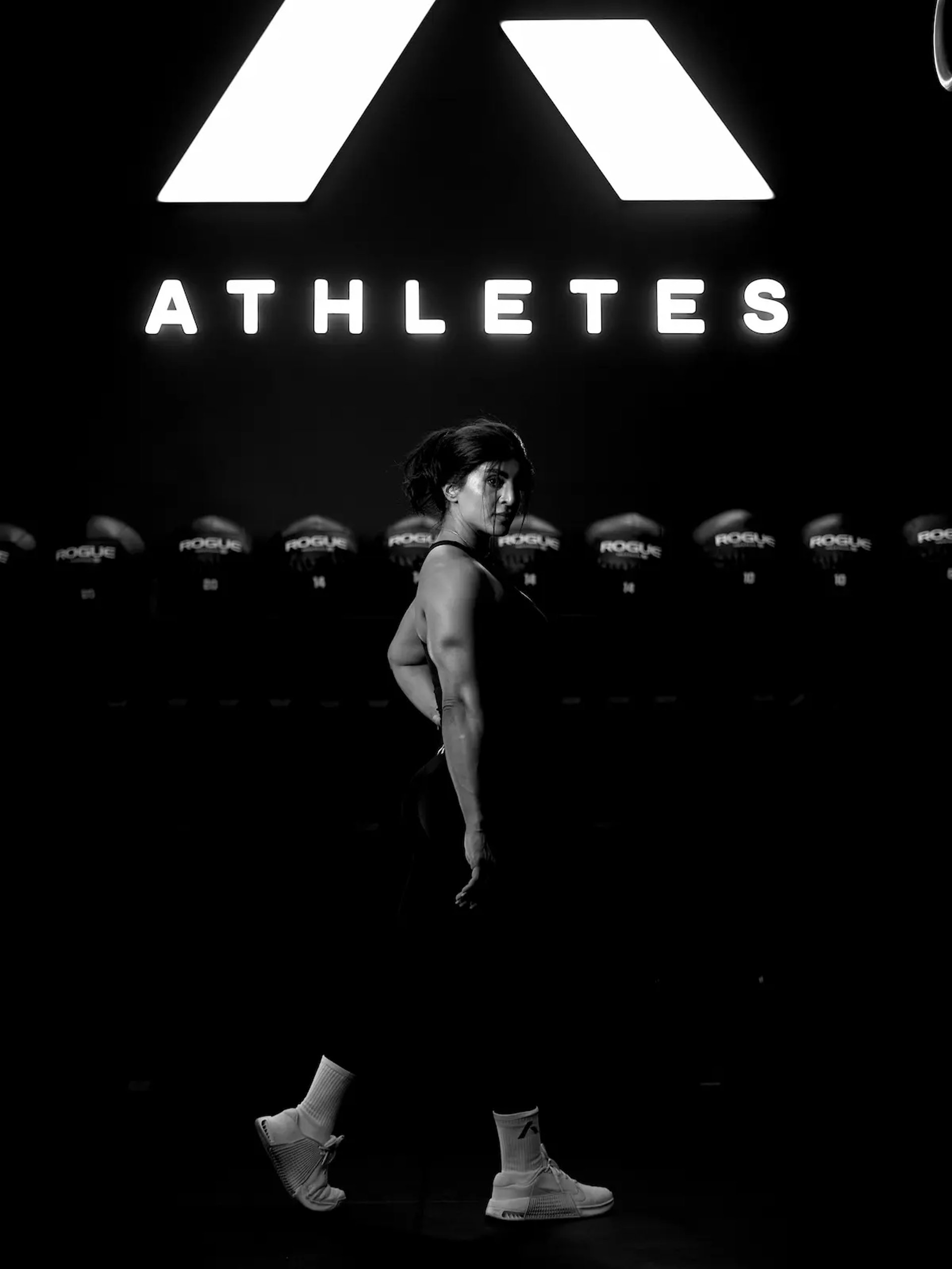 mais alhajri posting in profile under athletes training system logo during fitness photoshoot