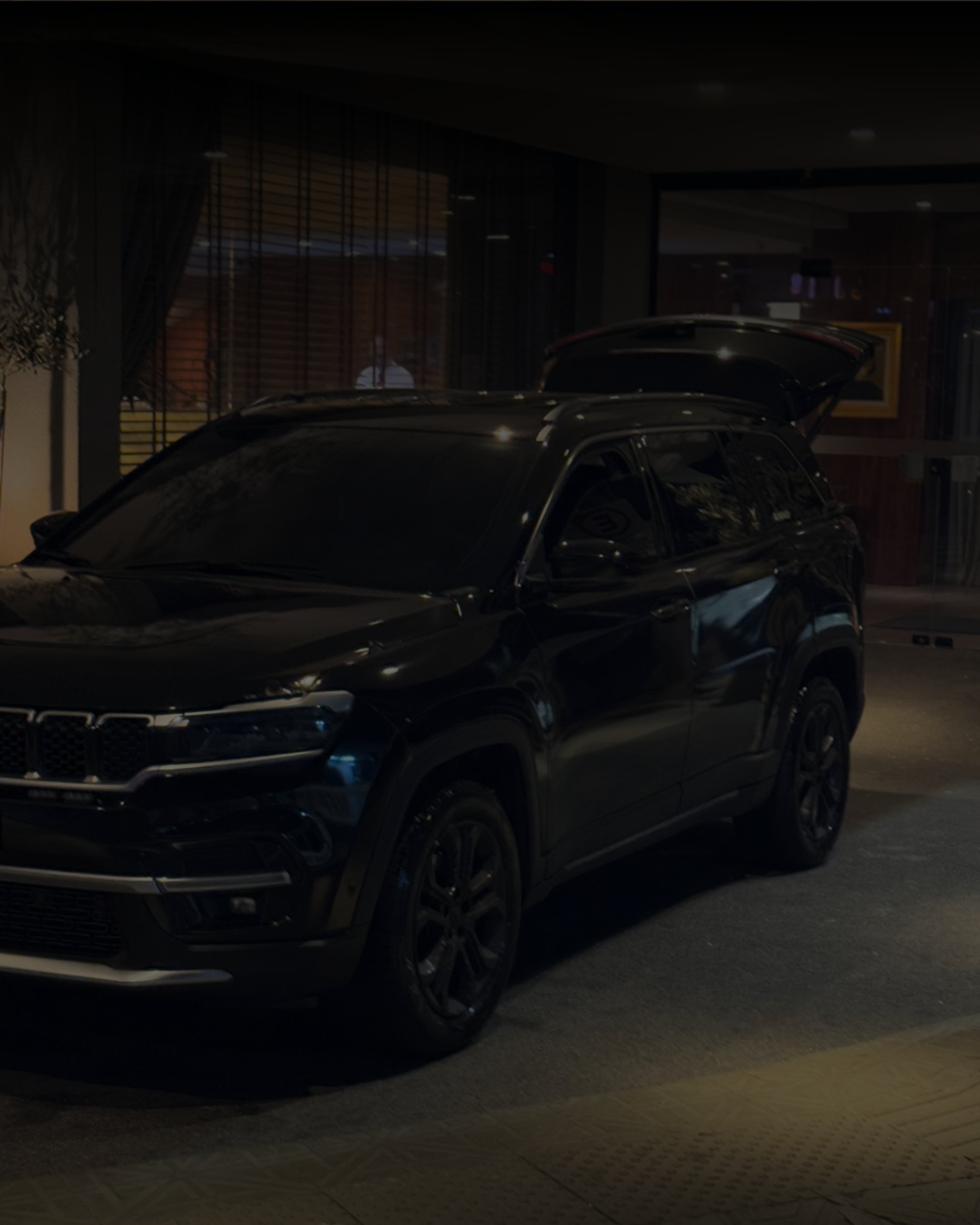 an abstract photo of a curved building with a blue sky in the background