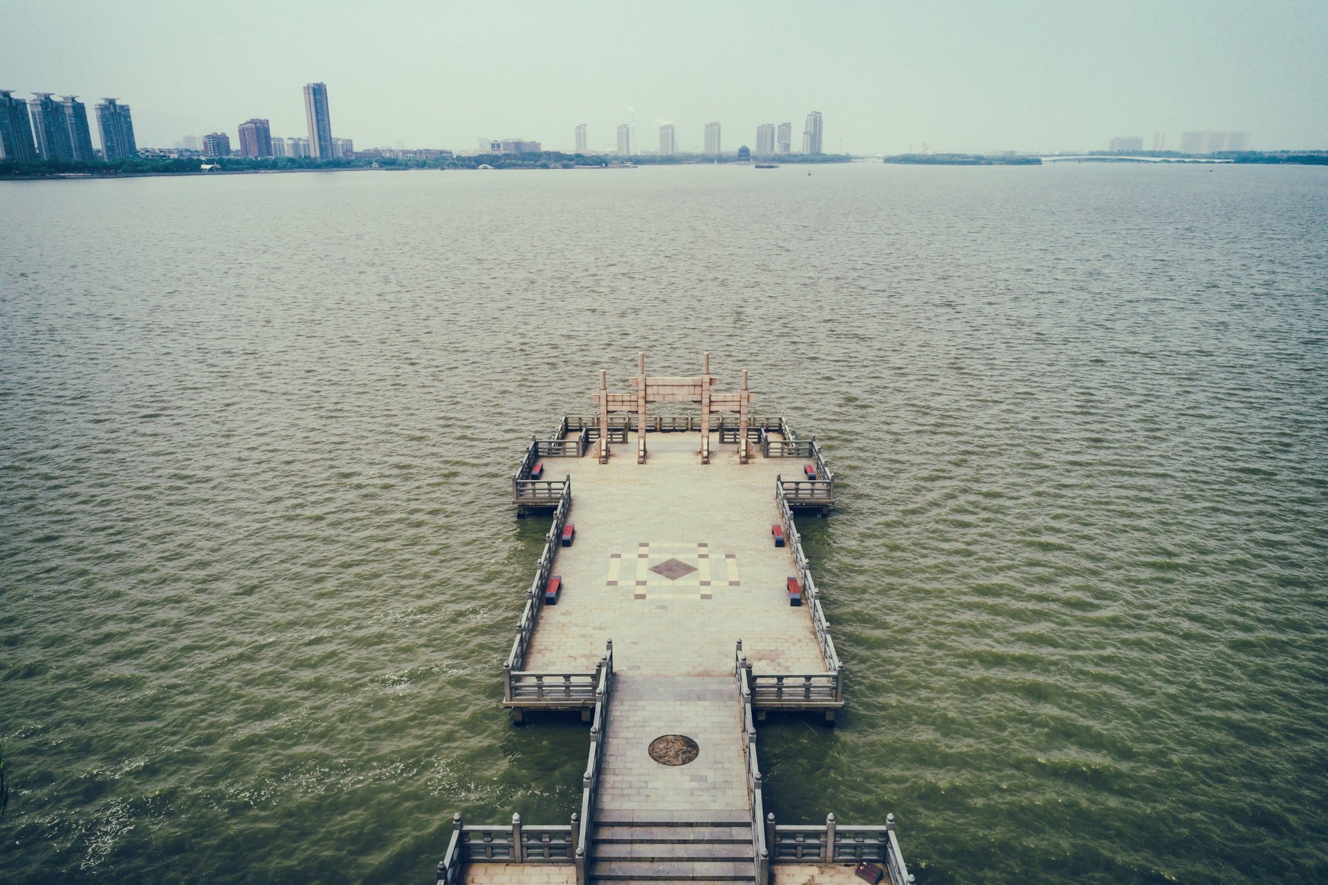 an abstract photo of a curved building with a blue sky in the background