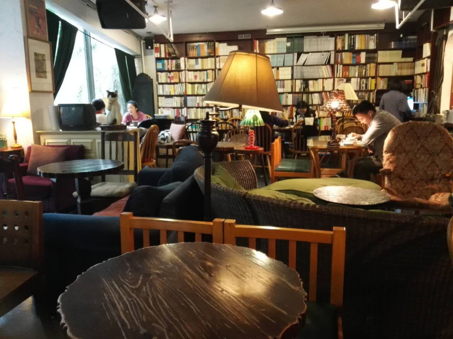 black and brown leather padded tub sofa