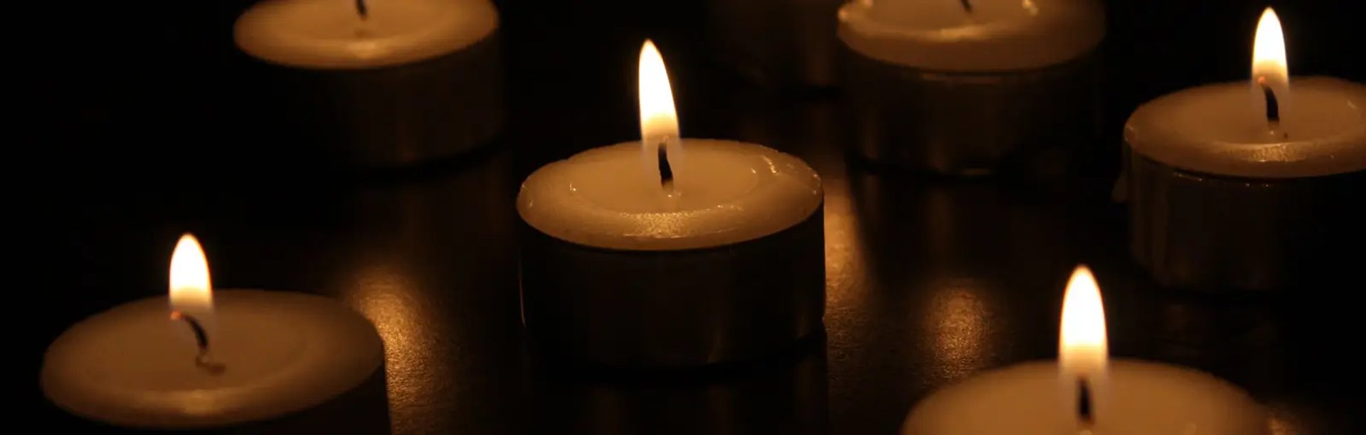 photo of lighted tealight candles