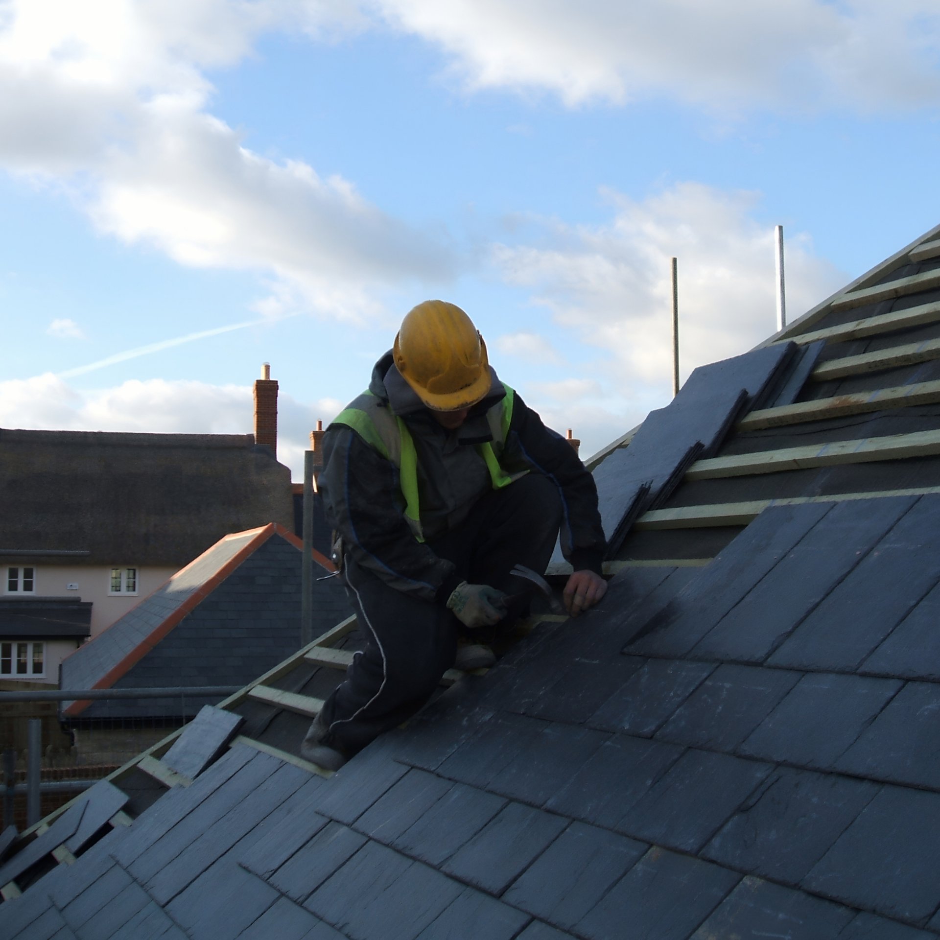 black rectangular device on brown roof
