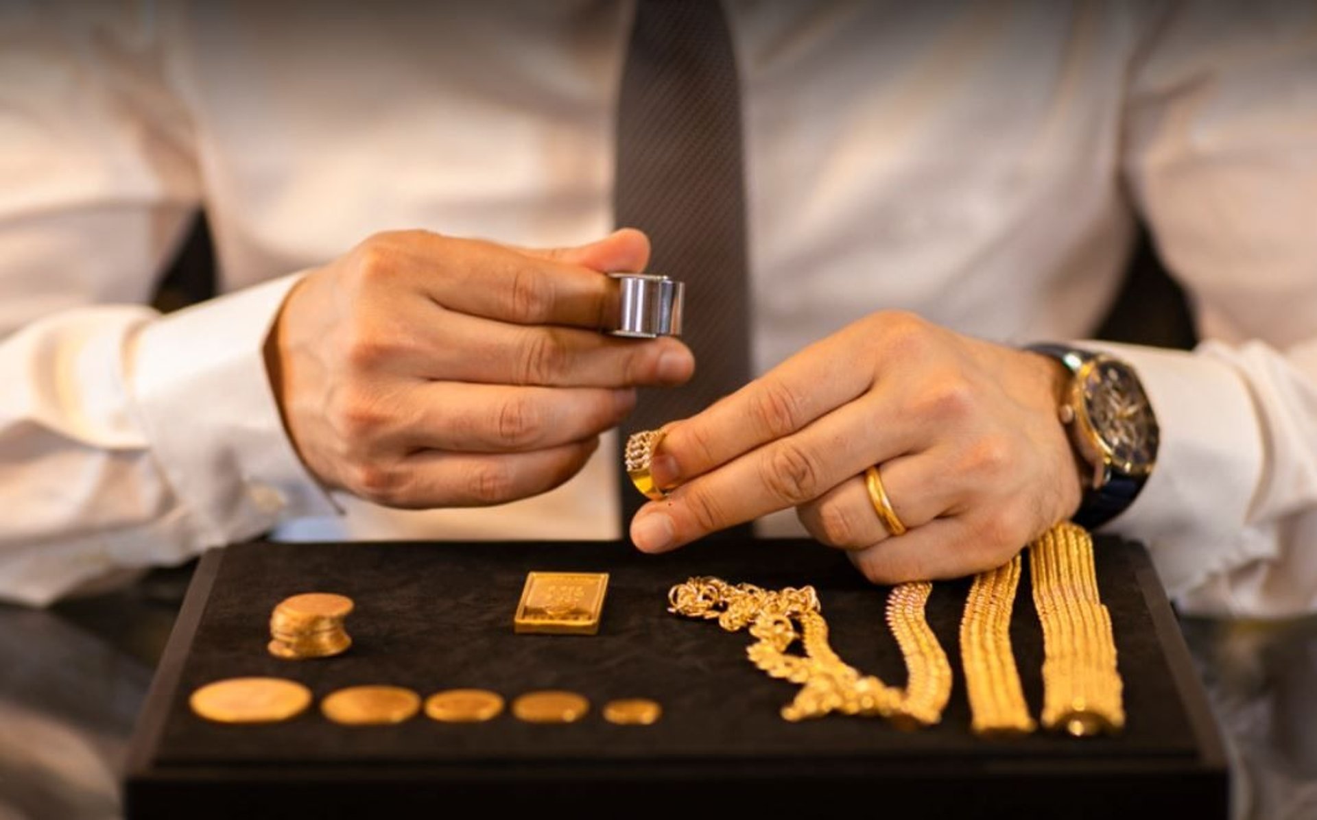 a bunch of gold bracelets are on display