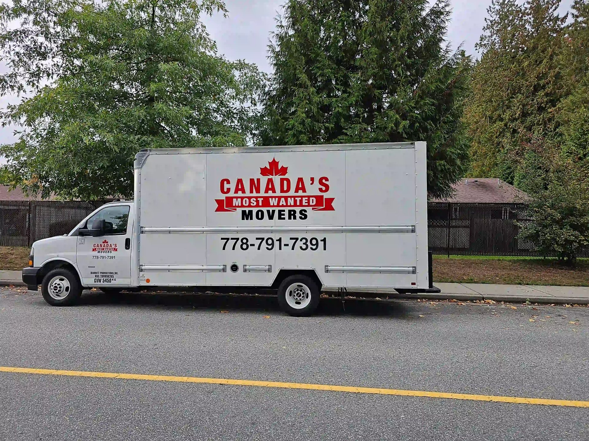 Canada’s Most Wanted Movers truck parked on a residential street in White Rock during a local move.