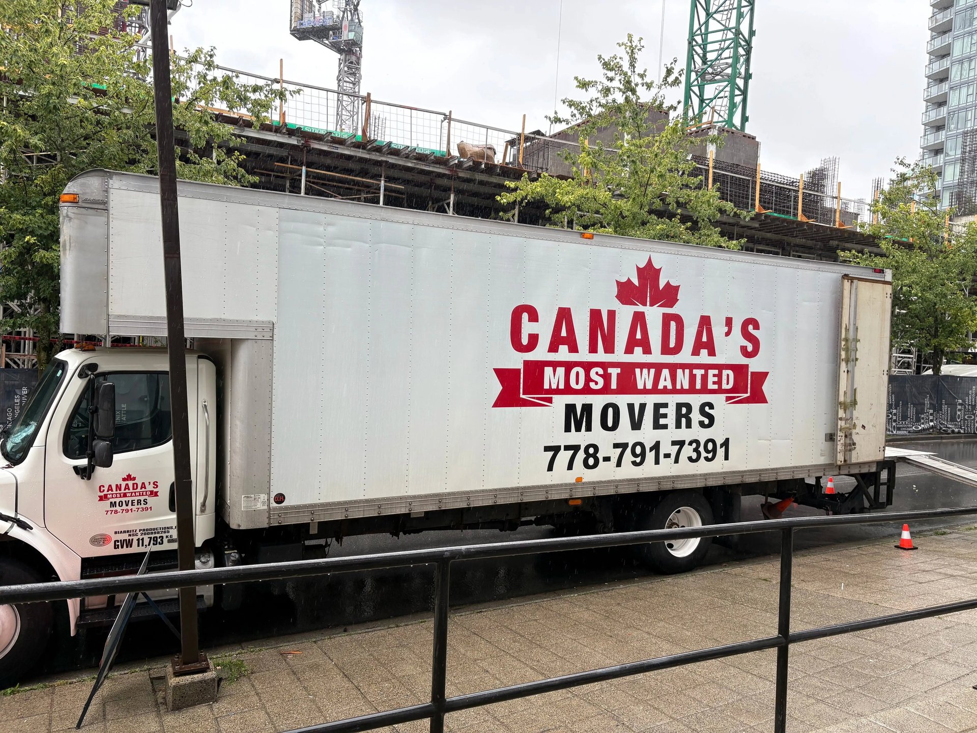 Canada’s Most Wanted Movers truck parked beside a construction project in Surrey, ready for a commercial move.