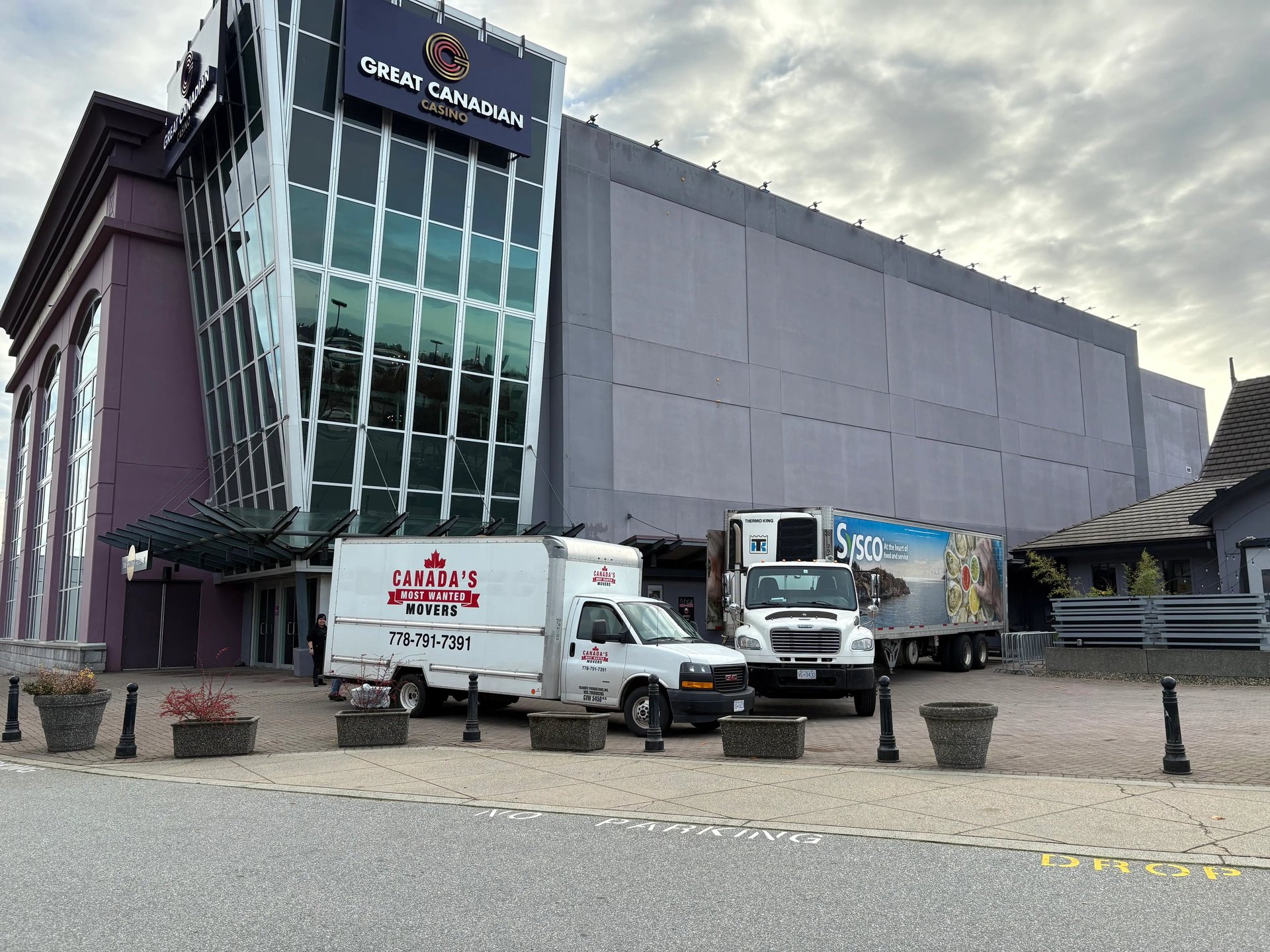 Canada’s Most Wanted Movers trucks parked at Great Canadian Casino Vancouver for a commercial moving job.